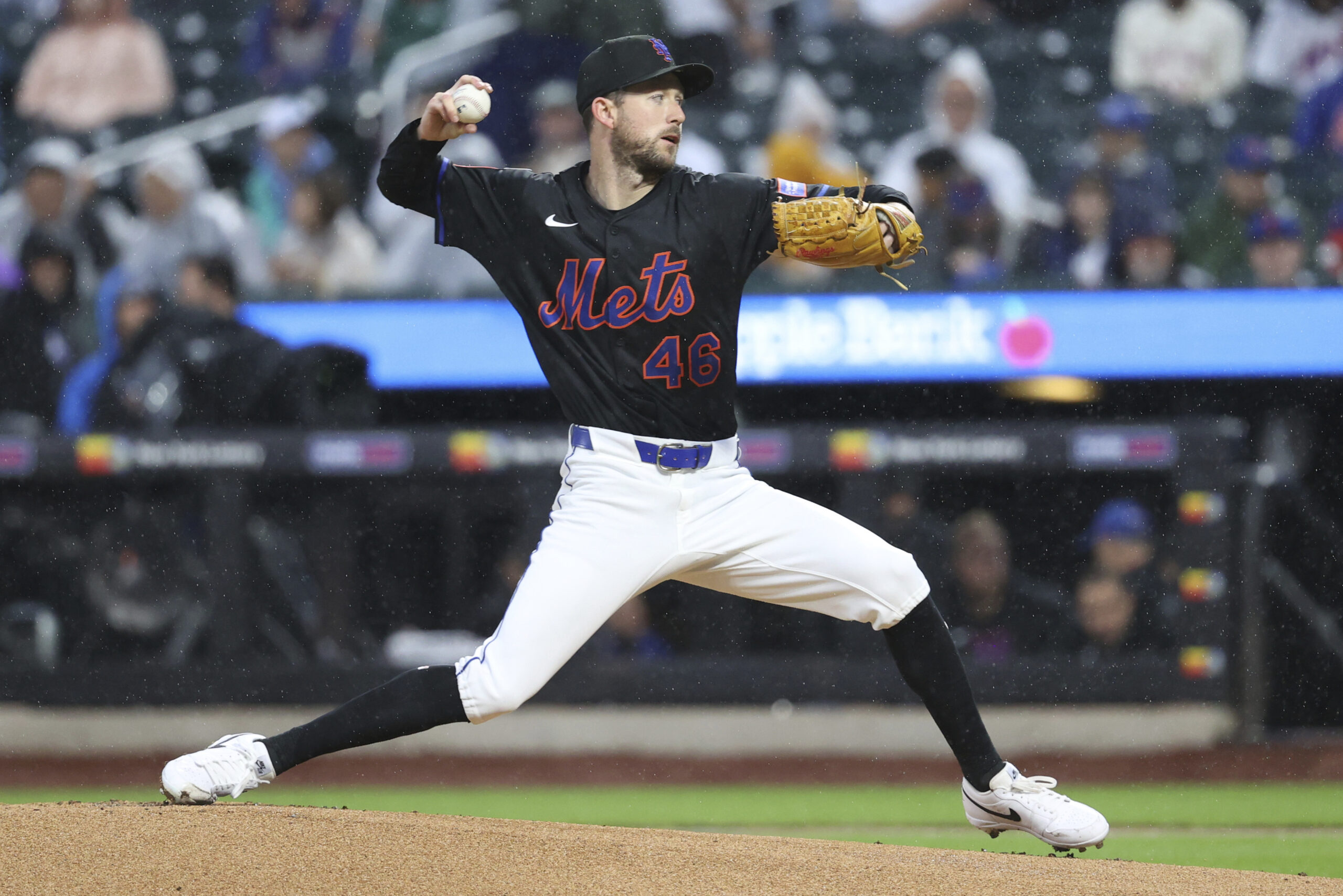 New York Mets starting pitcher Griffin Canning throws to the...
