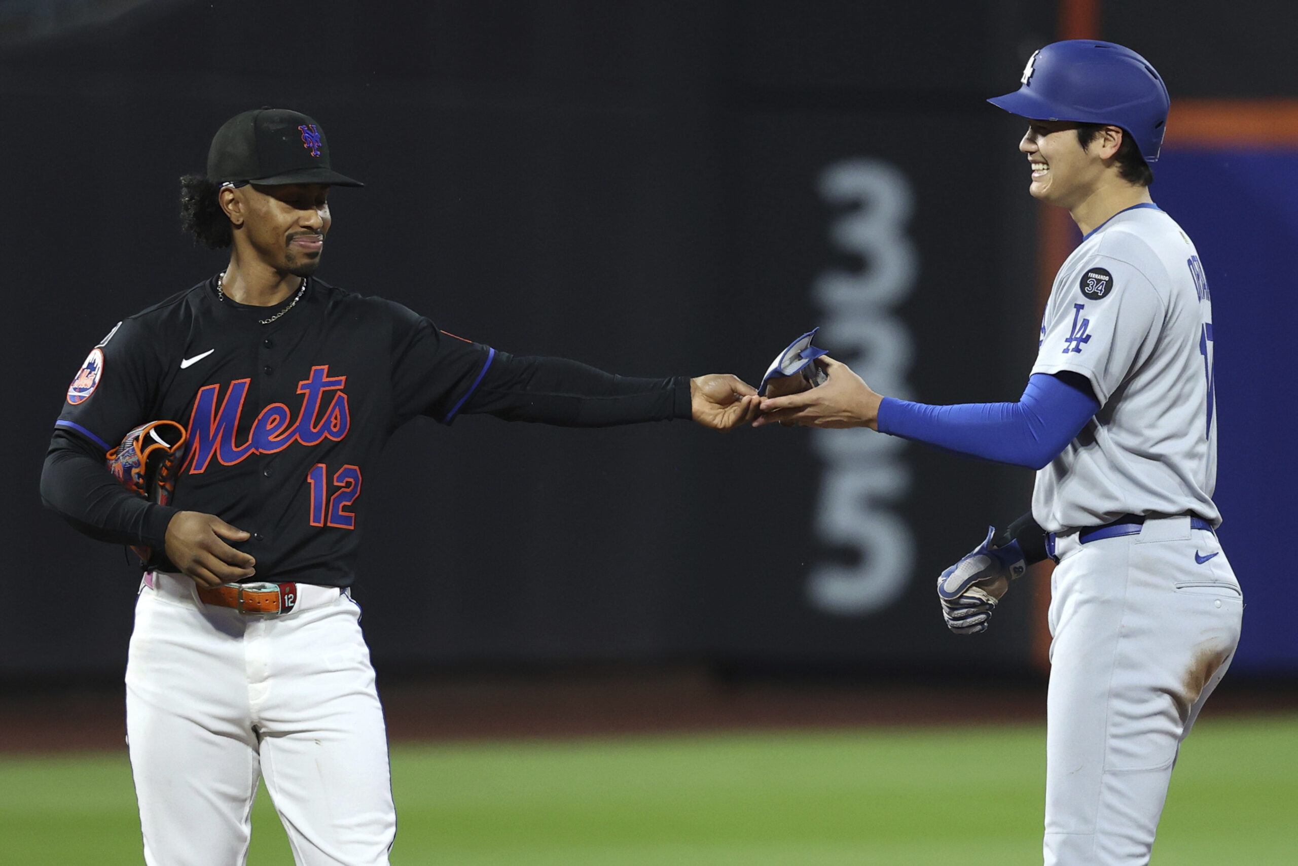 New York Mets shortstop Francisco Lindor, left, and Dodgers star...