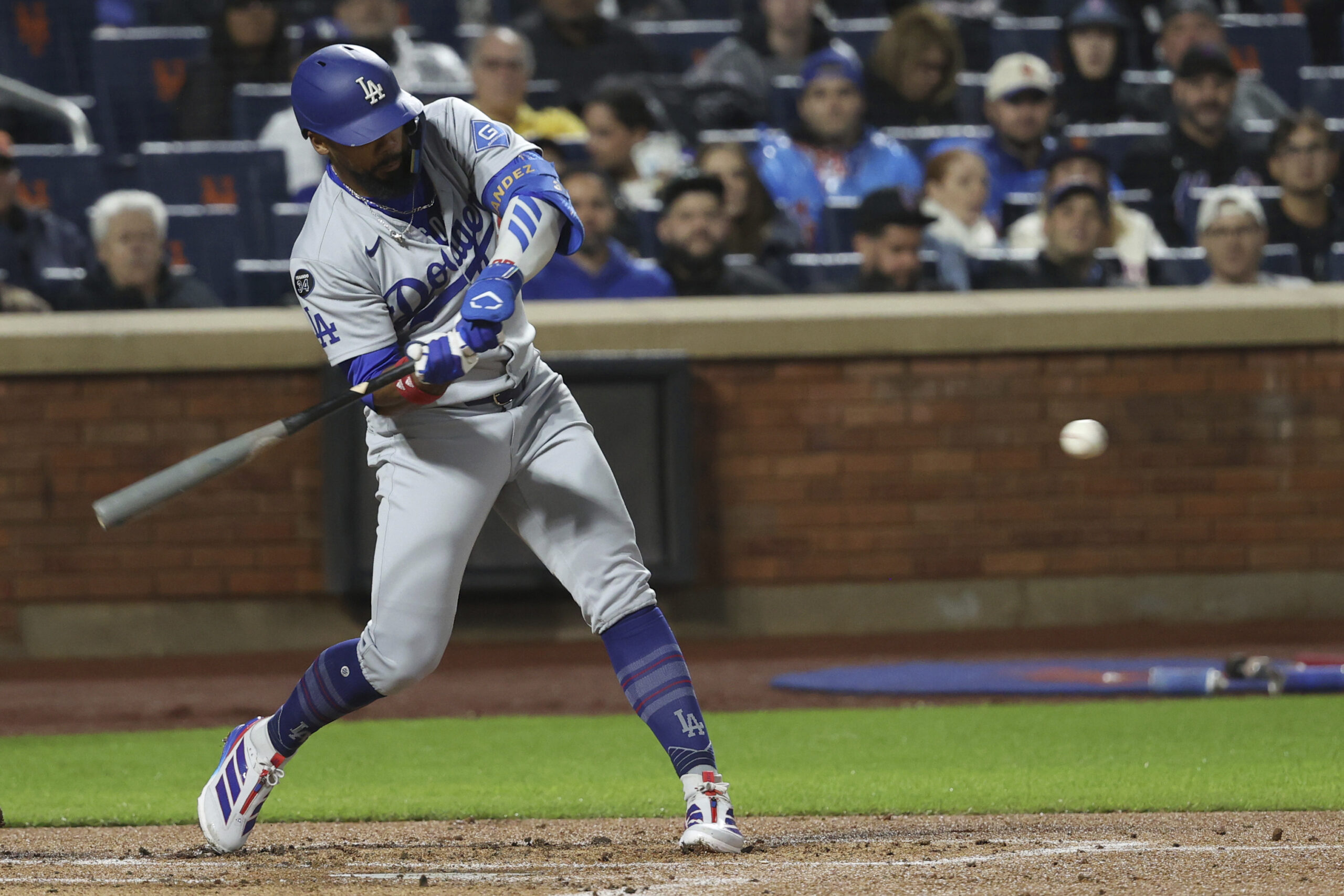 The Dodgers’ Teoscar Hernández hits a two-run single during the...
