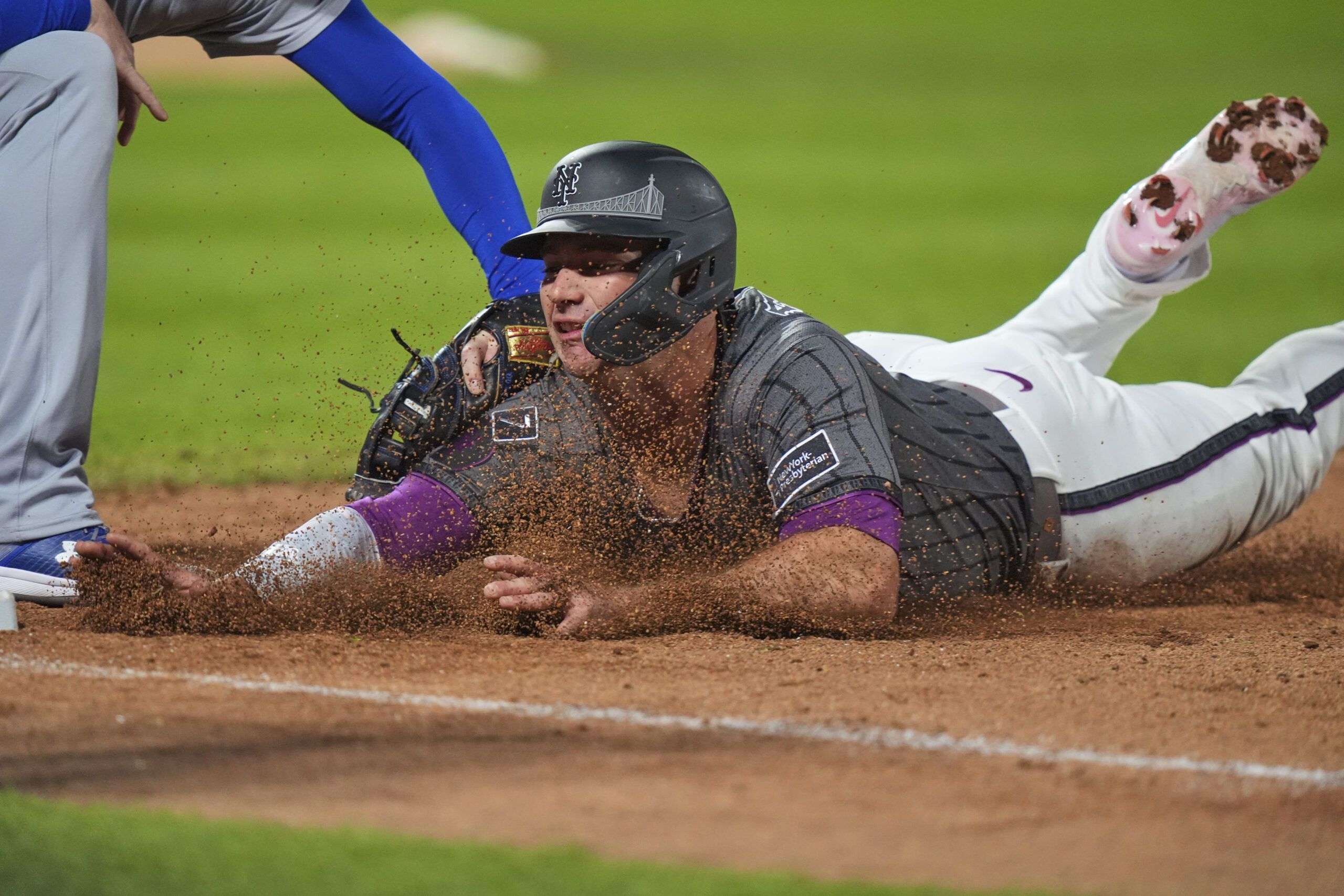 New York Mets’ Pete Alonso is tagged out at first...