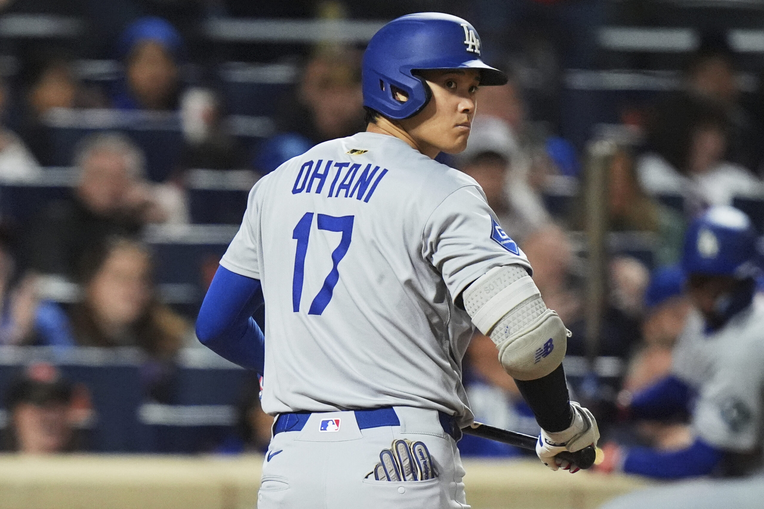 Dodgers’ Shohei Ohtani, of Japan, reacts after striking out during...