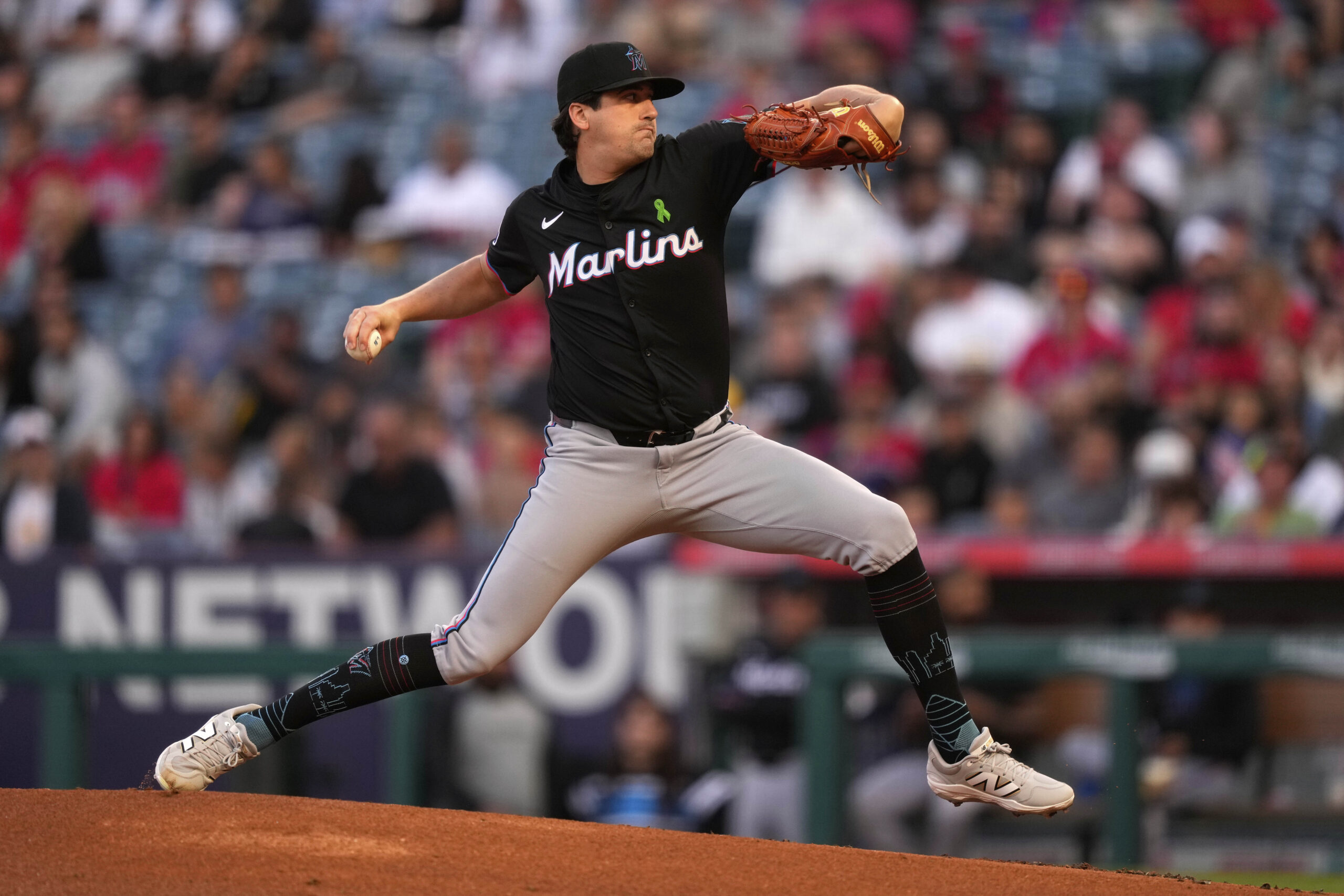 Miami Marlins starting pitcher Cal Quantrill throws to the plate...