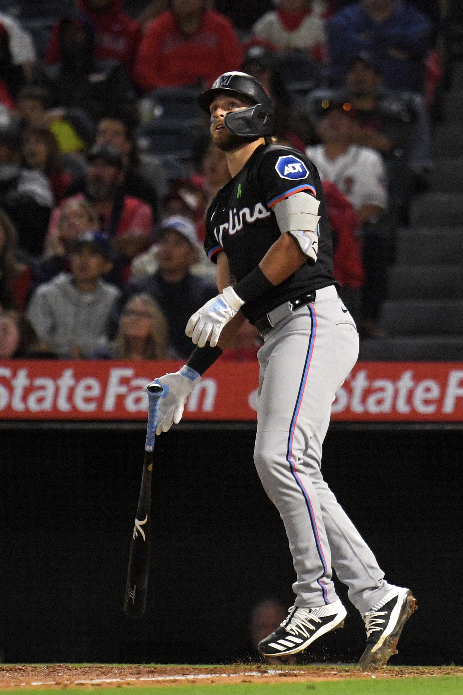 Miami Marlins’ Connor Norby watches his ball go out for...