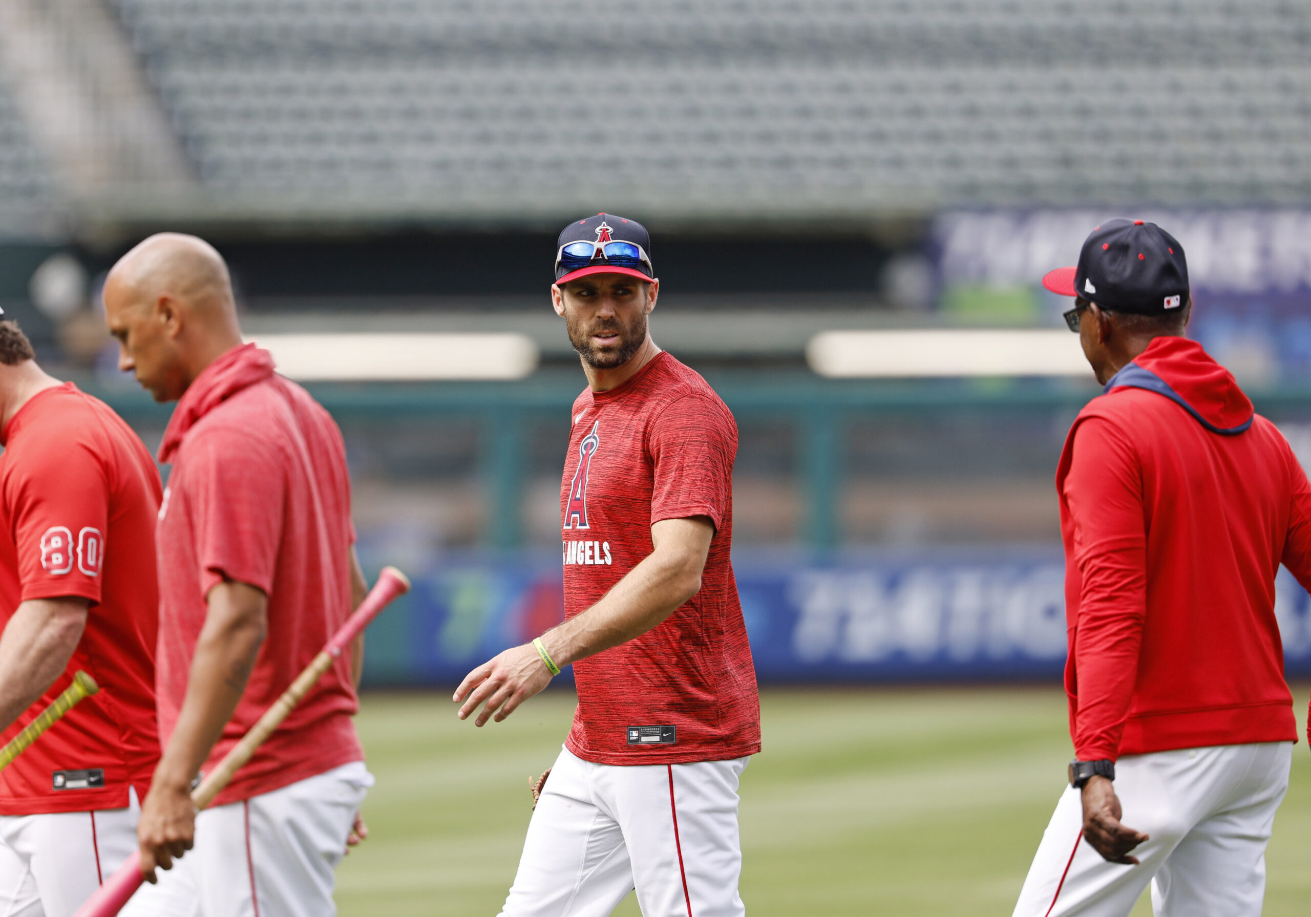 New Angels utility man Chris Taylor, center, talks with Manager...