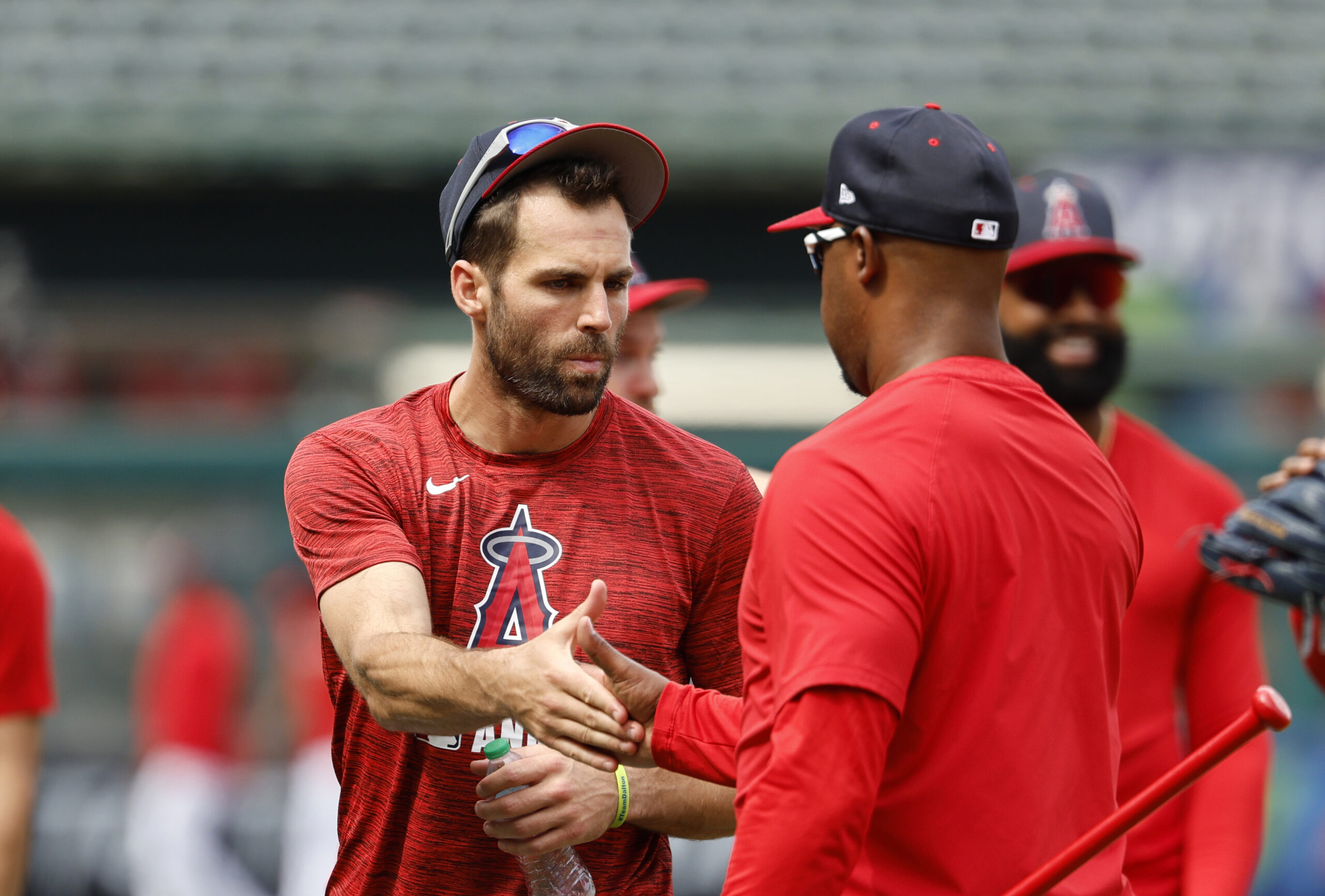 New Angels utility man Chris Taylor, left, is greeted by...