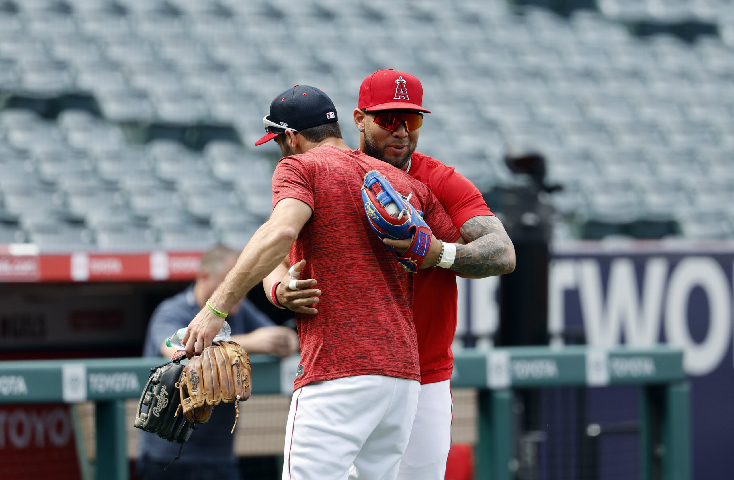 New Angels utility man Chris Taylor, left, is greeted by...