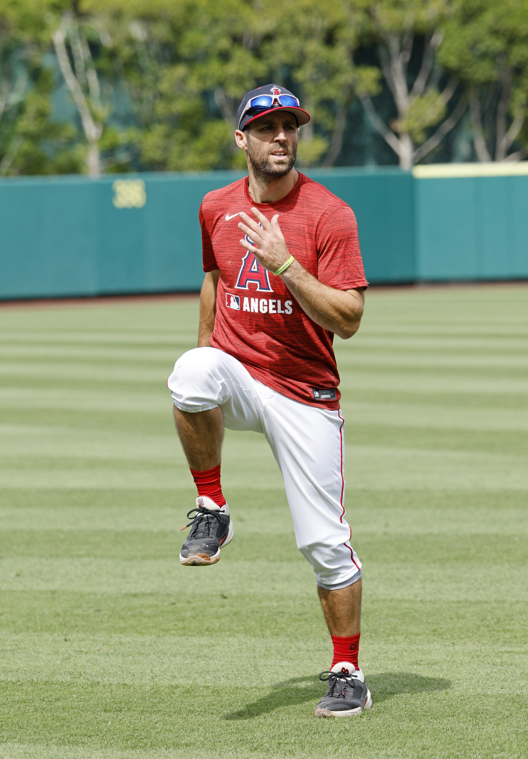 New Angels utility man Chris Taylor warms up before their...