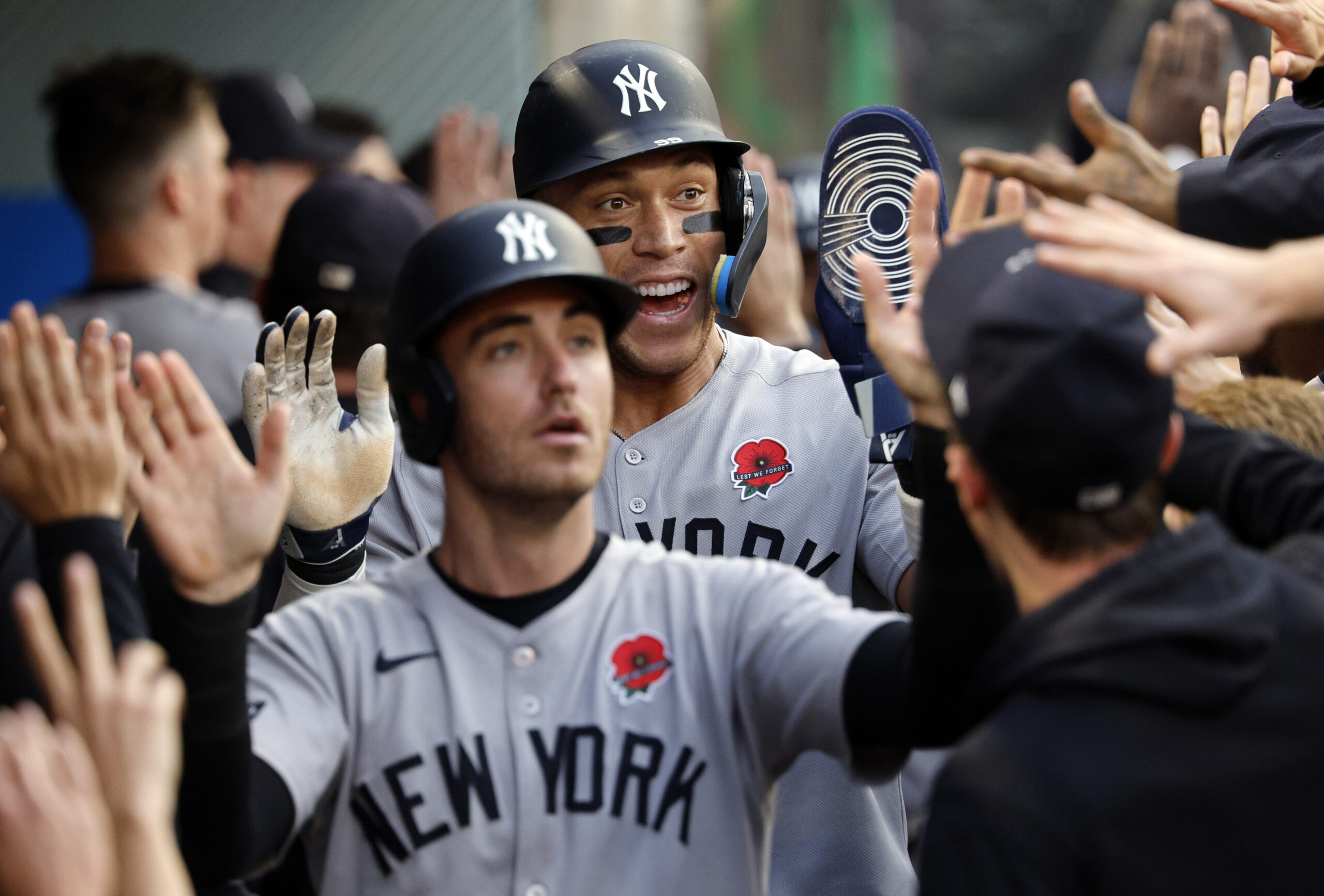 The New York Yankees’ Cody Bellinger, center left, and Aaron...