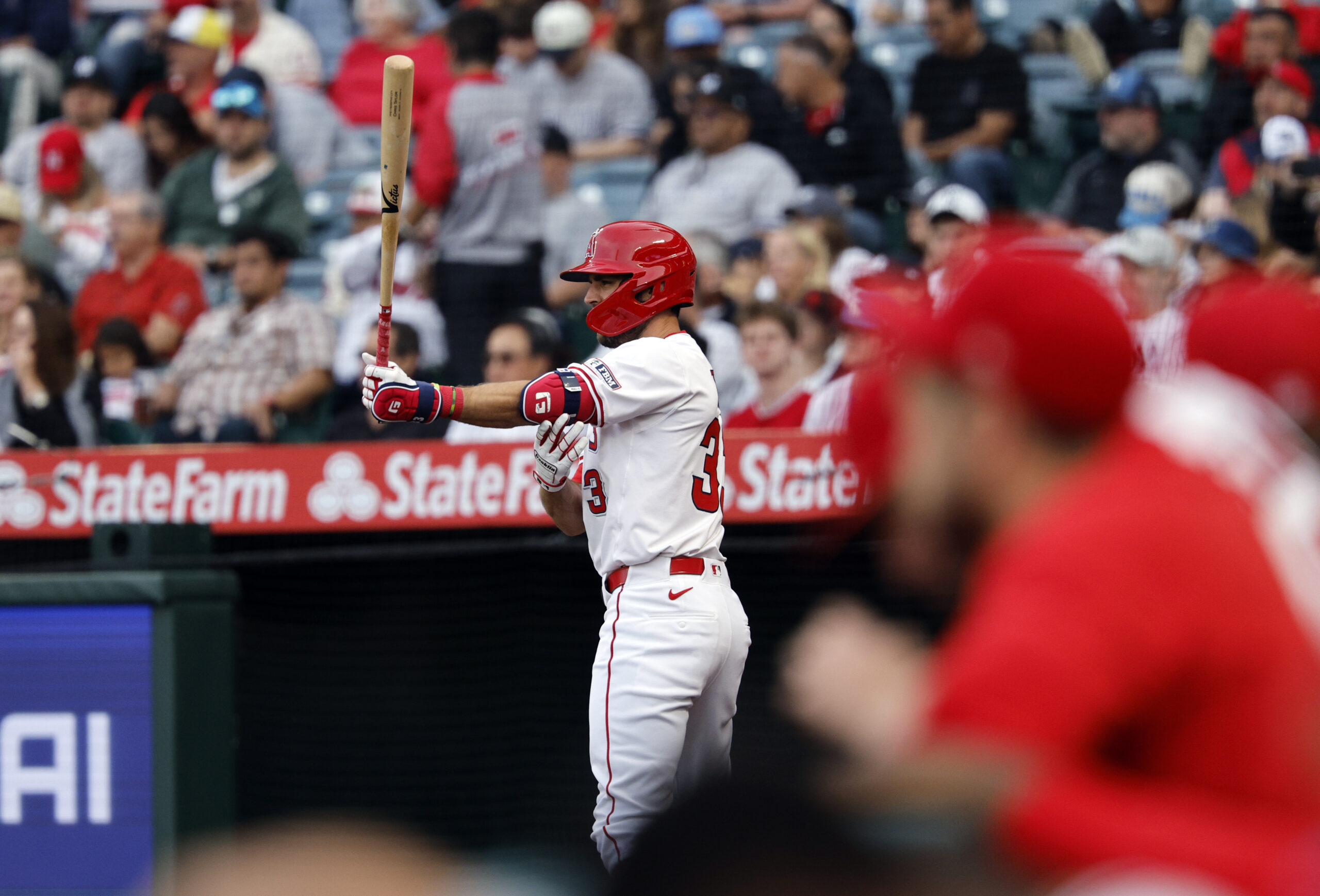 New Angels utility man Chris Taylor warms up in the...