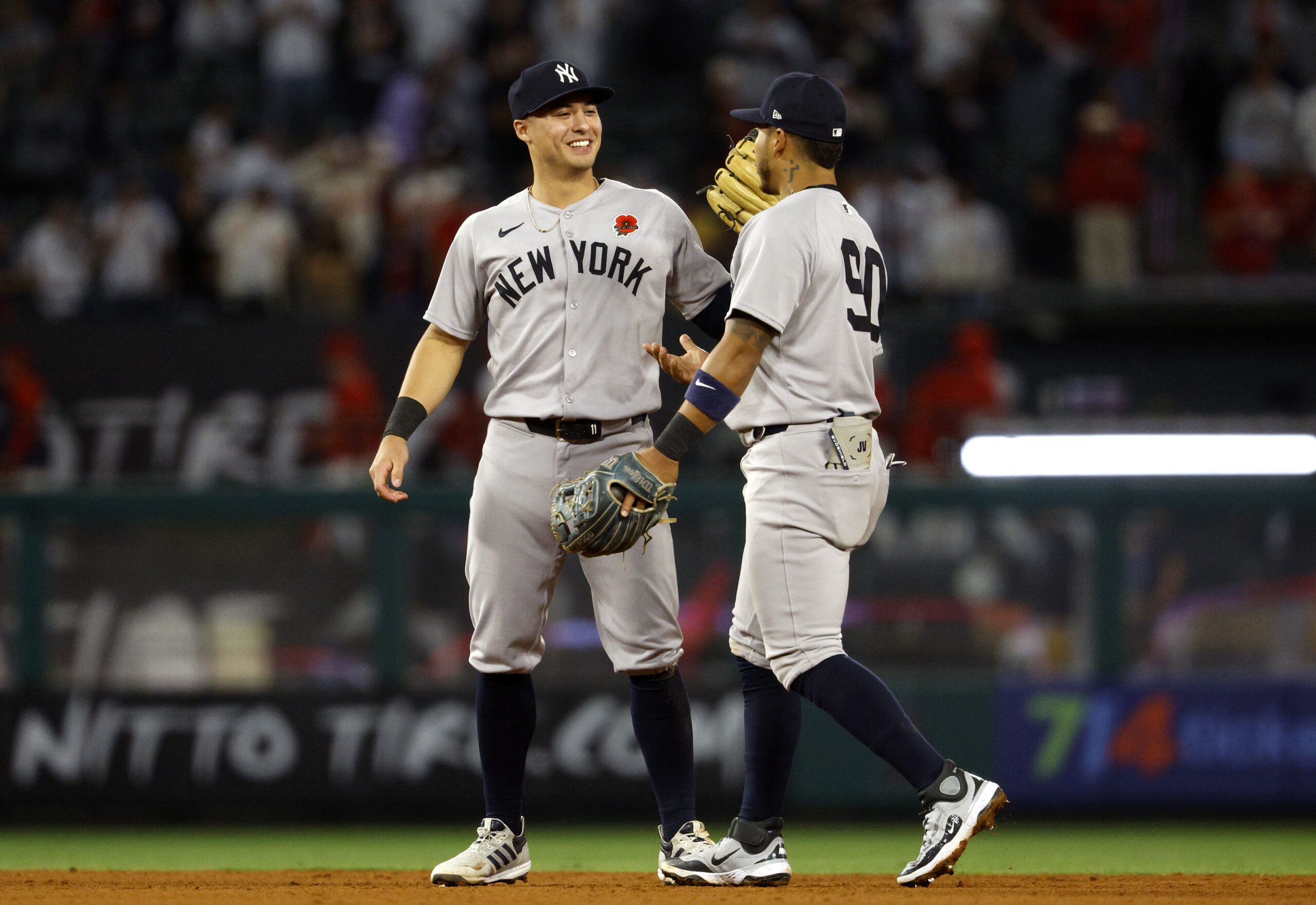 The New York Yankees’ Anthony Volpe, left, celebrates with Jorbit...