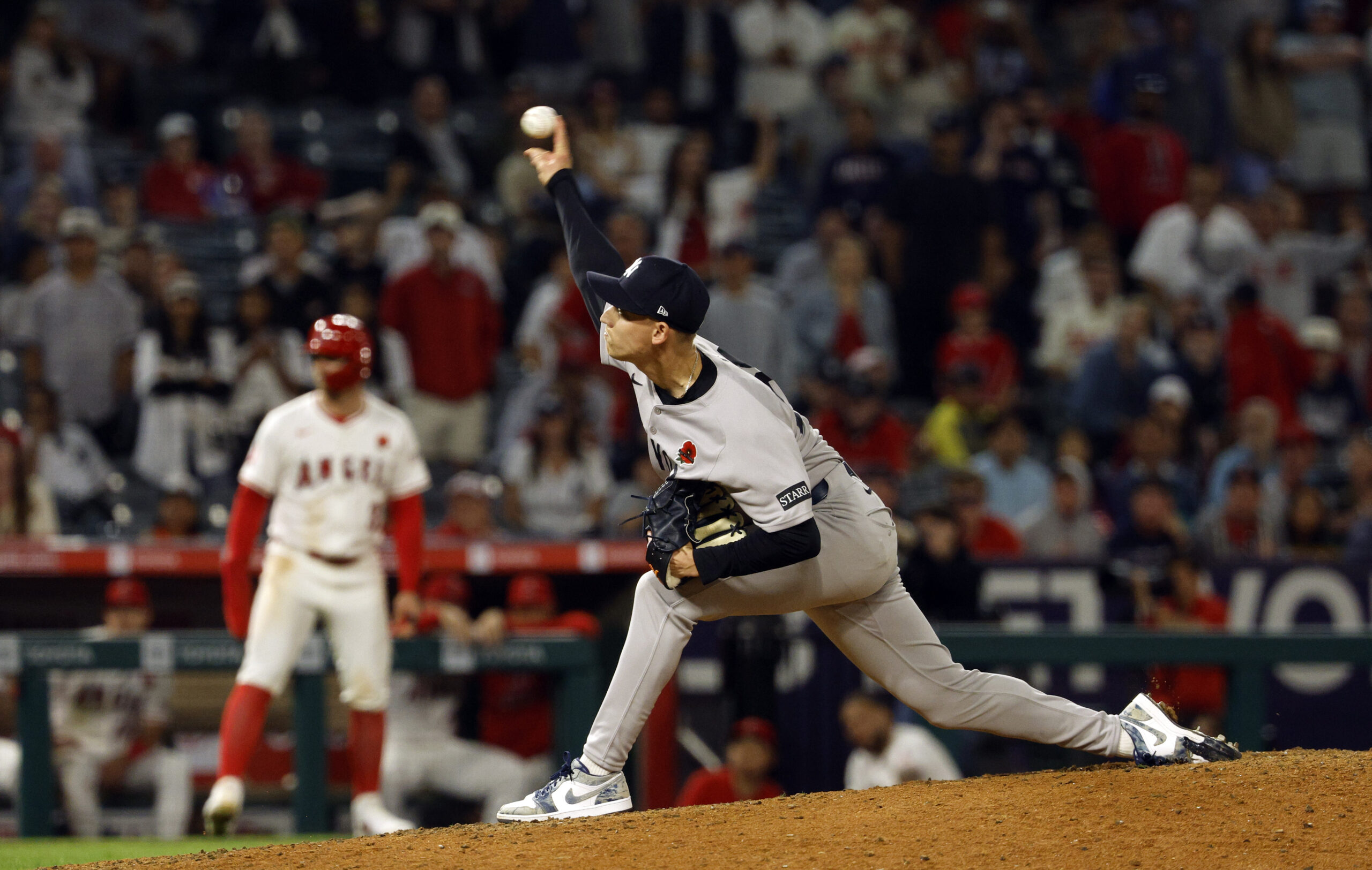 New York Yankees relief pitcher Luke Weaver throws against the...