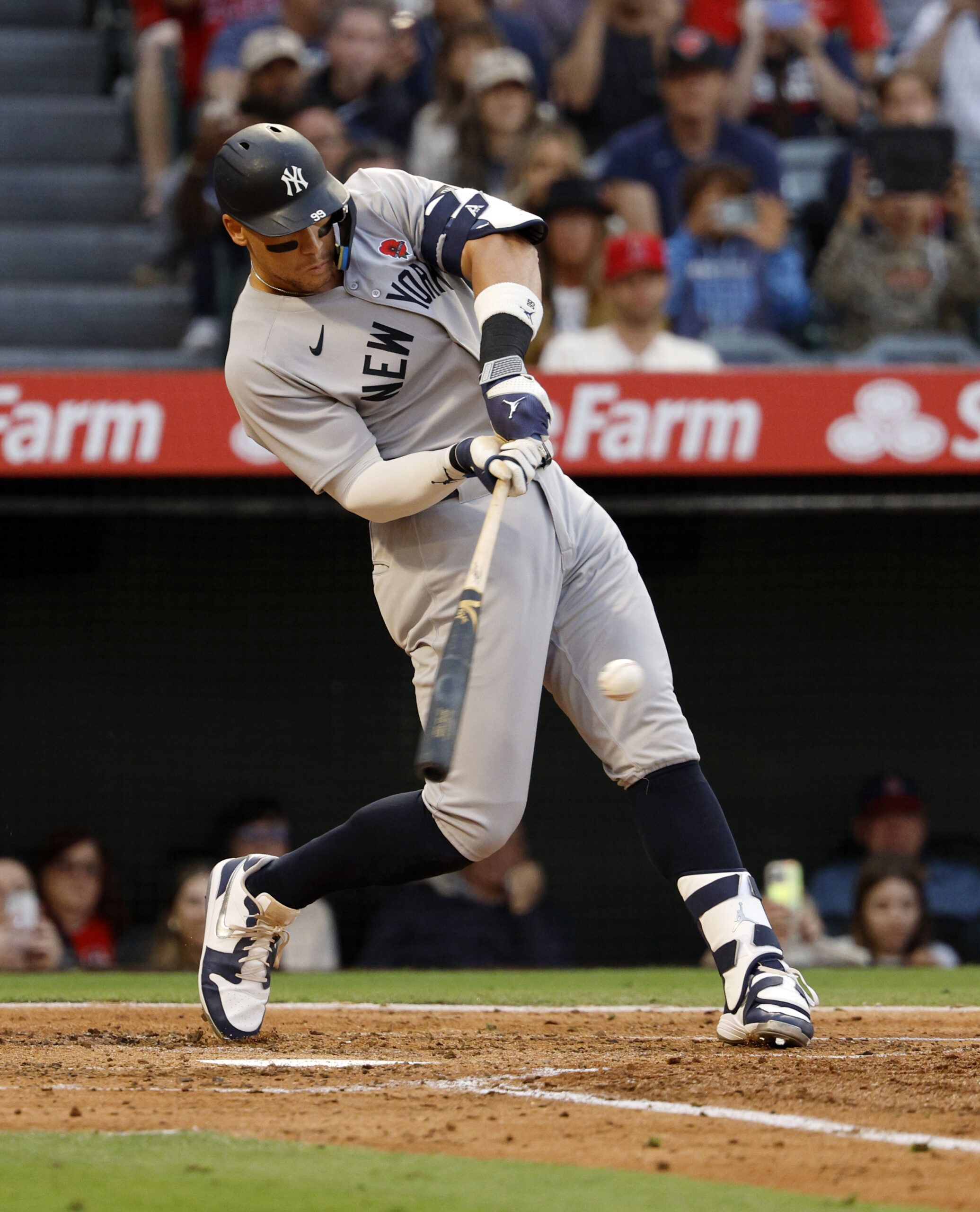 New York Yankees star Aaron Judge hits a base hit...