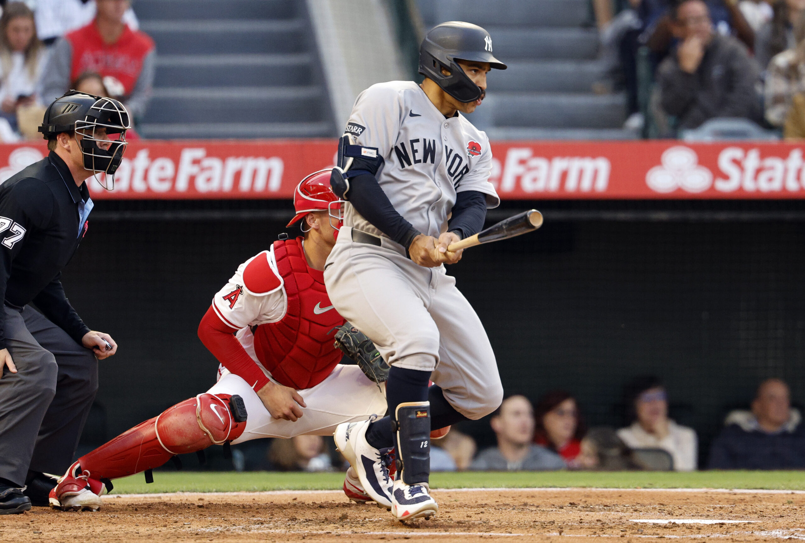 The New York Yankees’ Trent Grisham hits a base hit...