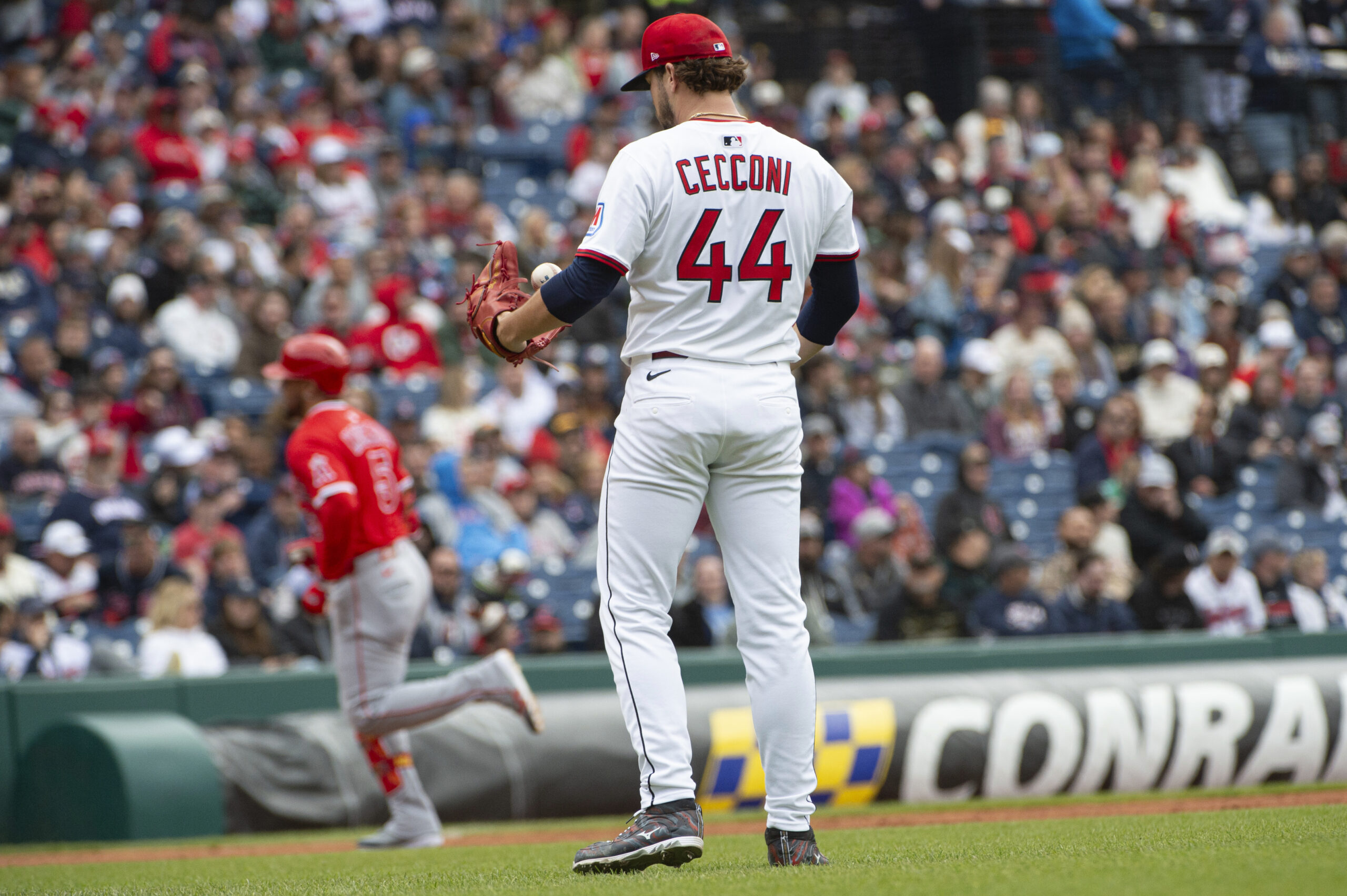 Cleveland Guardians starting pitcher Slade Cecconi (44) looks on as...