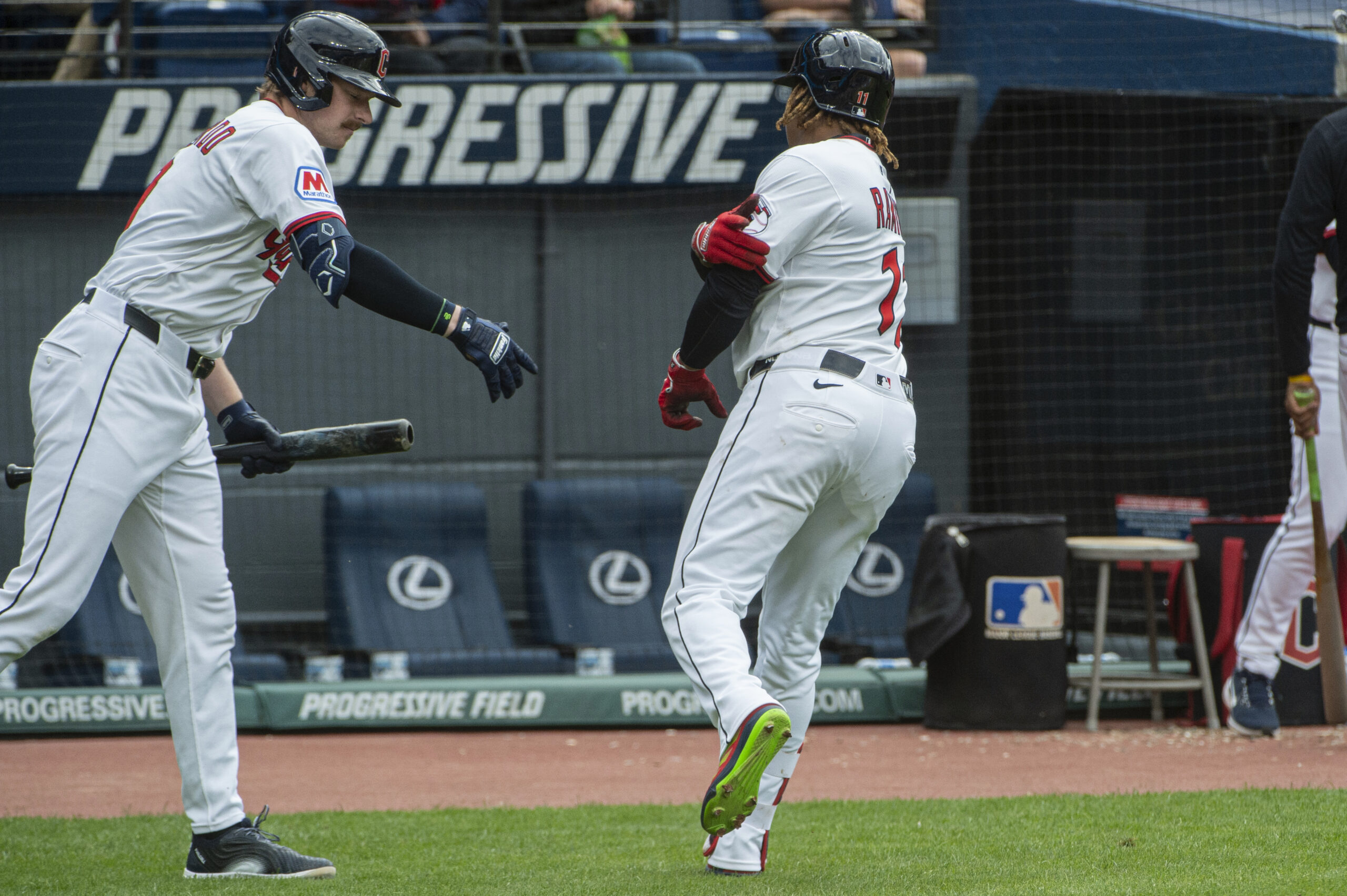 Cleveland Guardians’ Kyle Manzardo, left, congratulates Jose Ramirez, right, after...