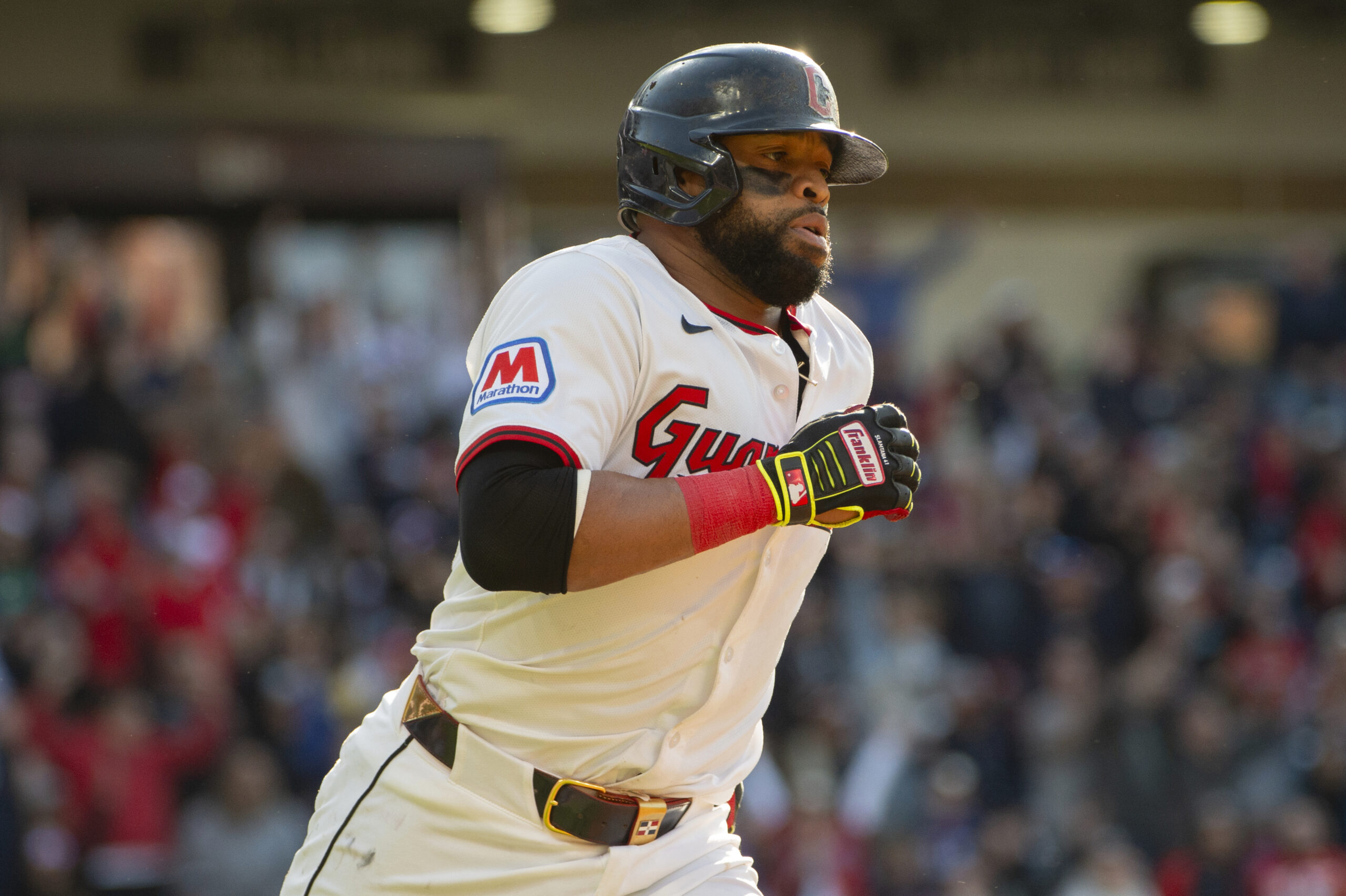 Cleveland Guardians’ Carlos Santana rounds the bases after hitting a...