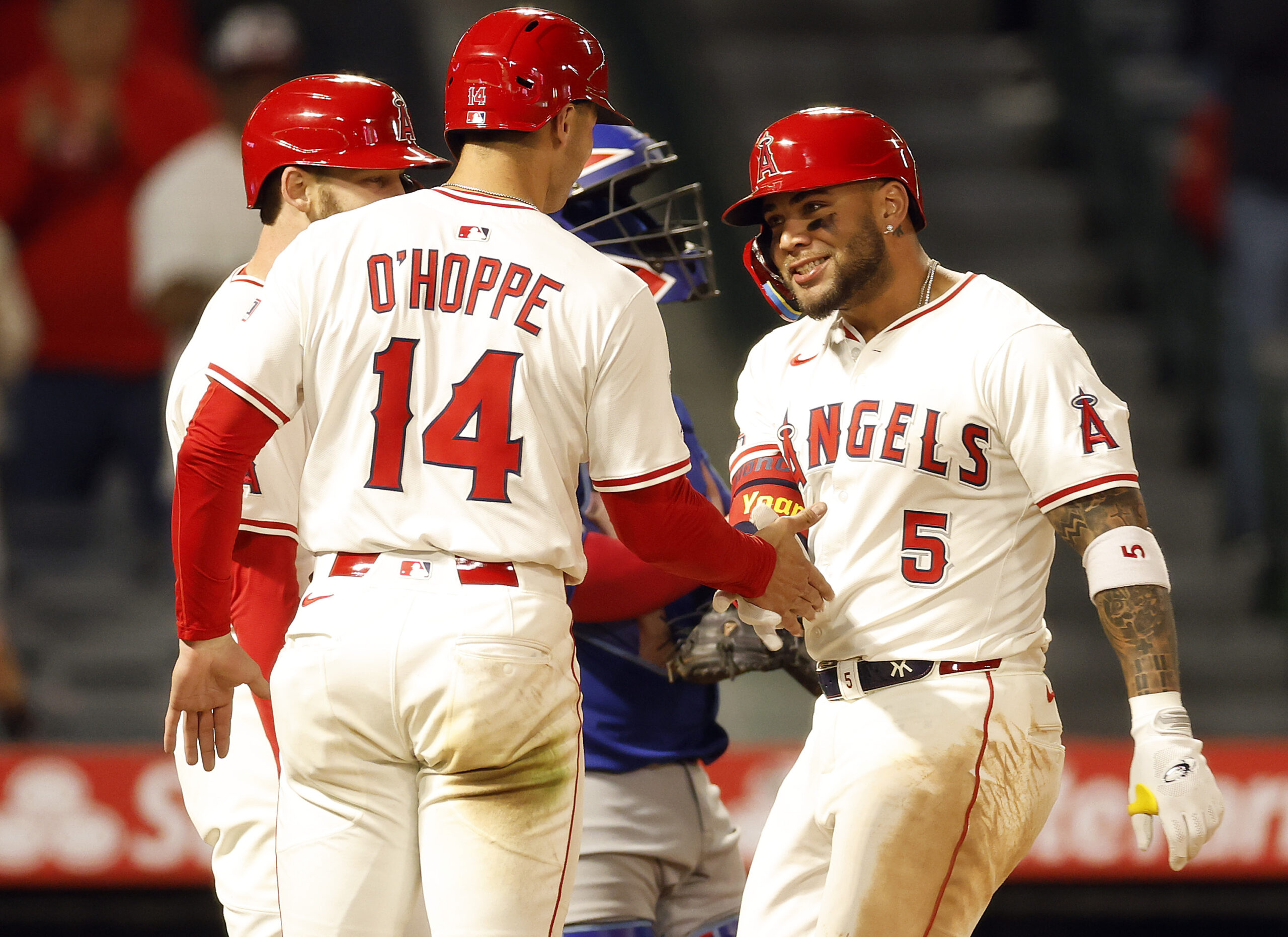 The Angels’ Yoan Moncada, right, celebrates with Logan O’Hoppe (14)...