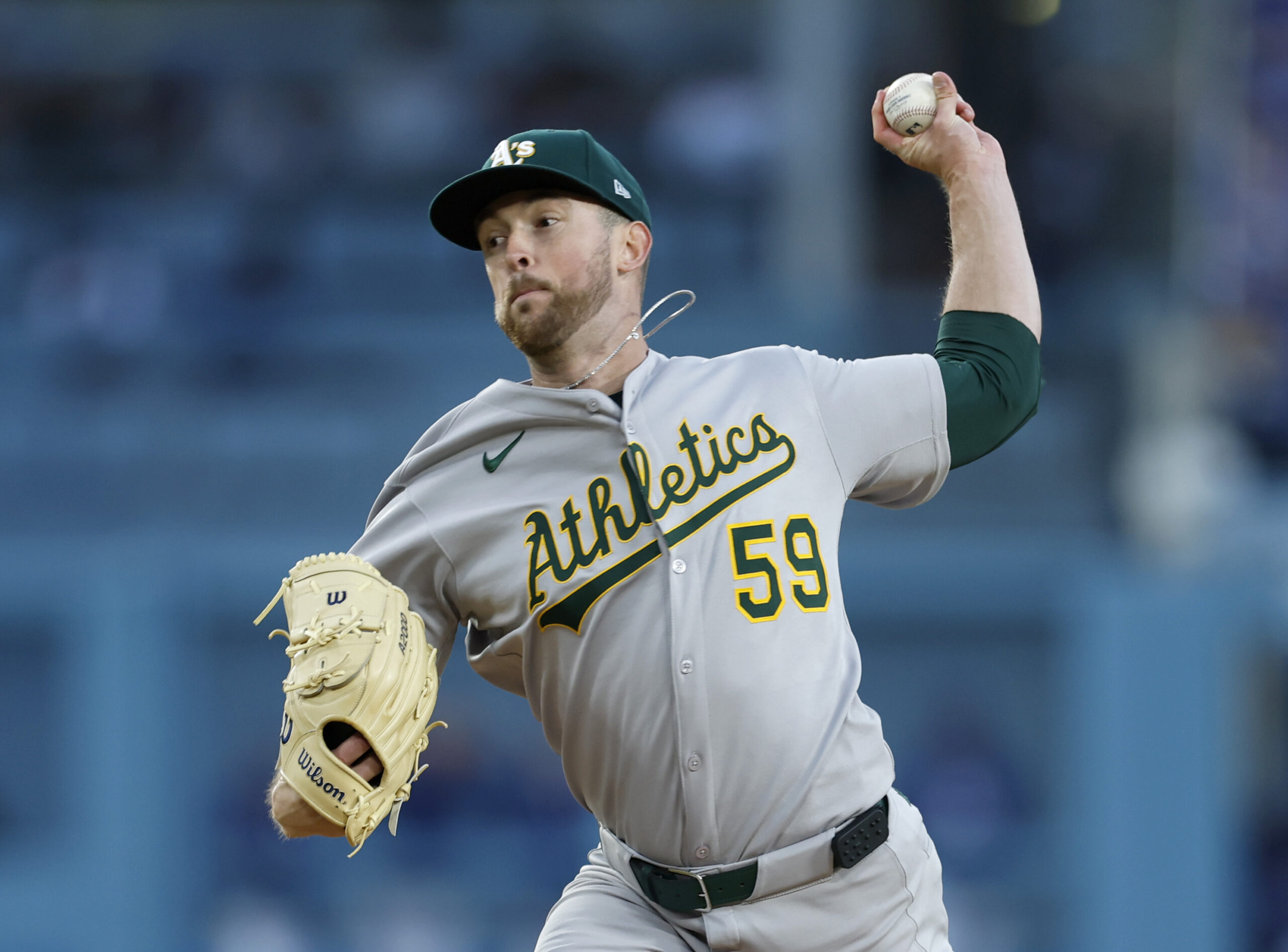 A’s starting pitcher Jeffrey Springs throws to the plate during...