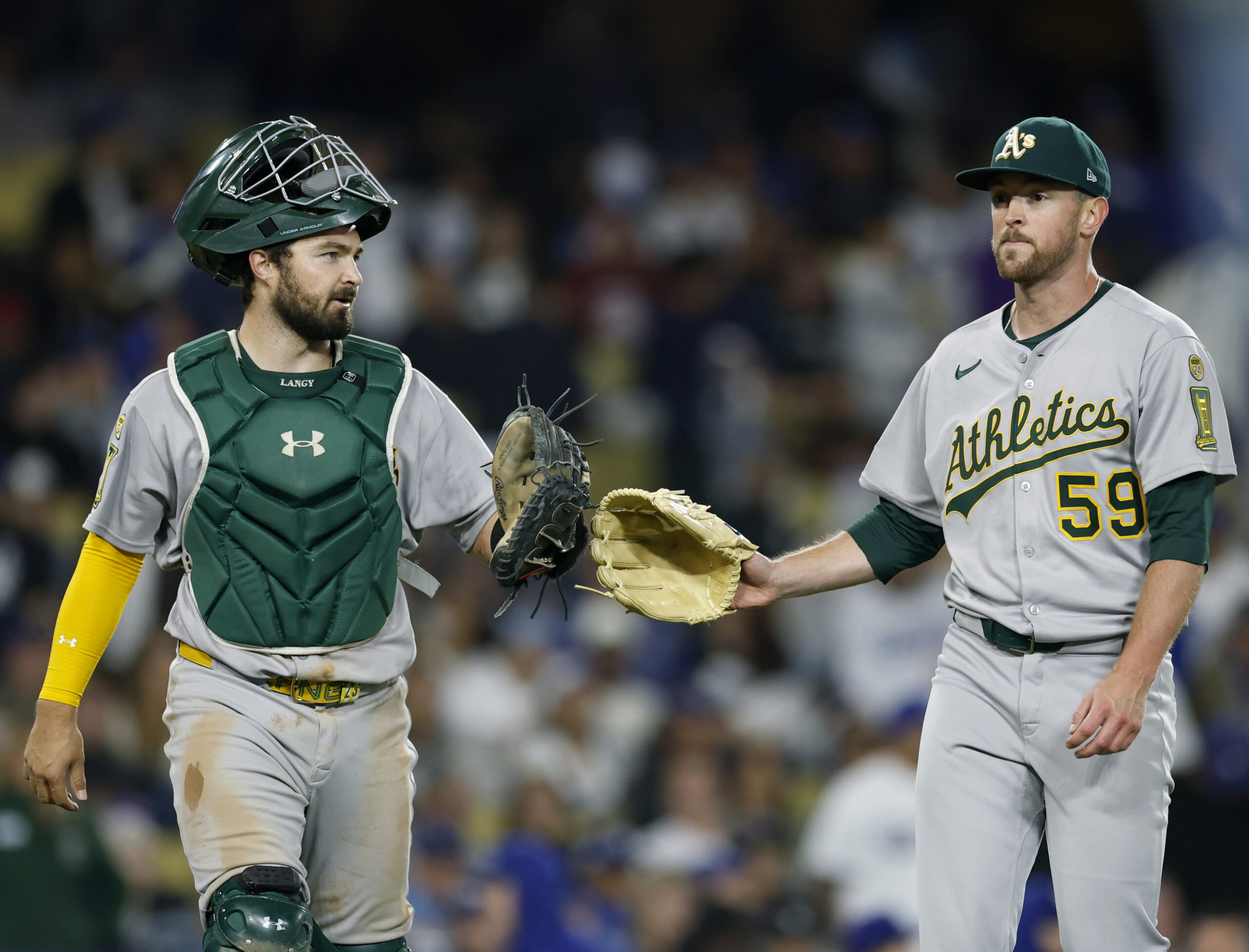 Athletics starting pitcher Jeffrey Springs, right, celebrates with catcher Shea...