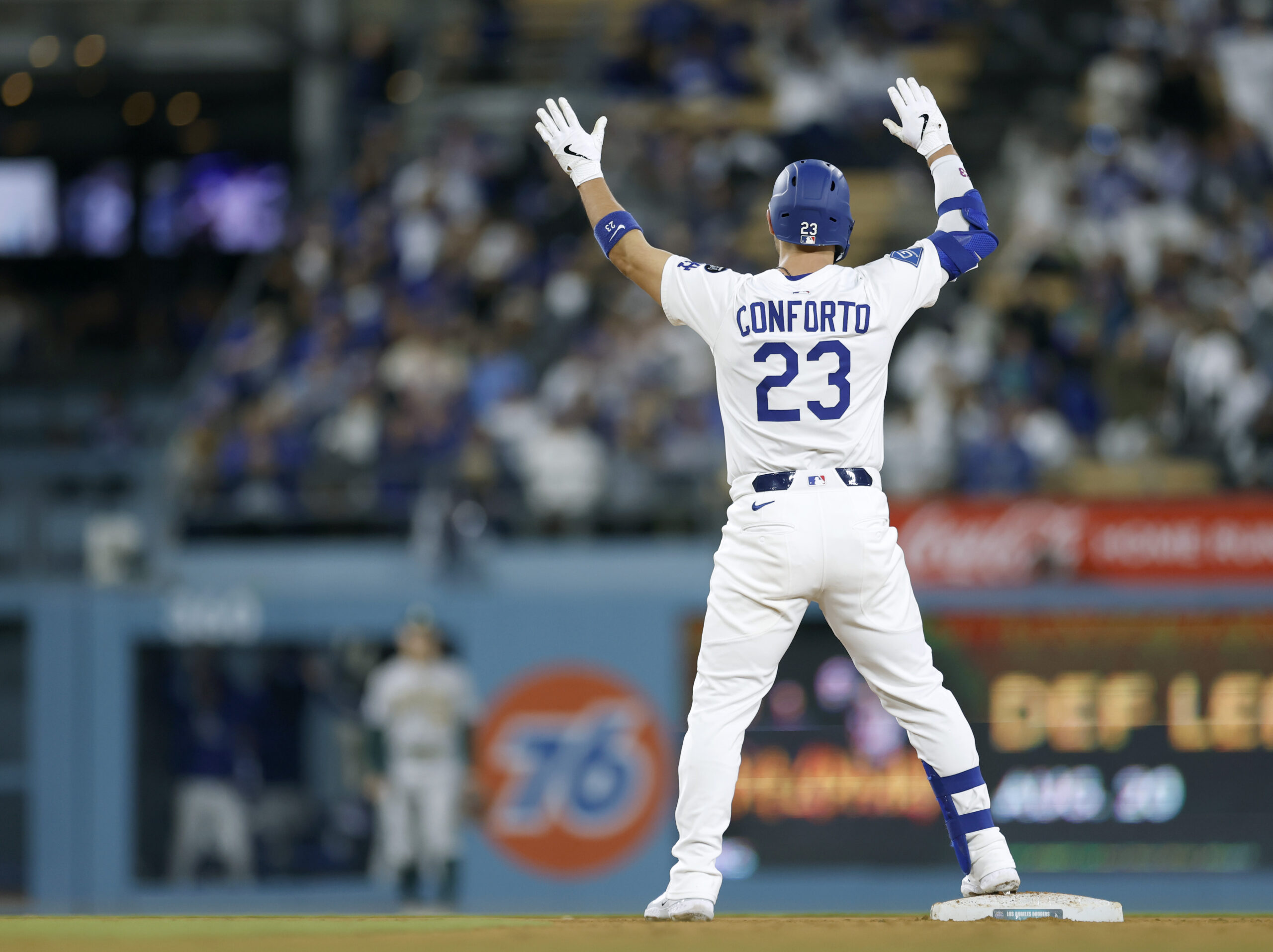 The Dodgers’ Michael Conforto celebrates his third double of the...