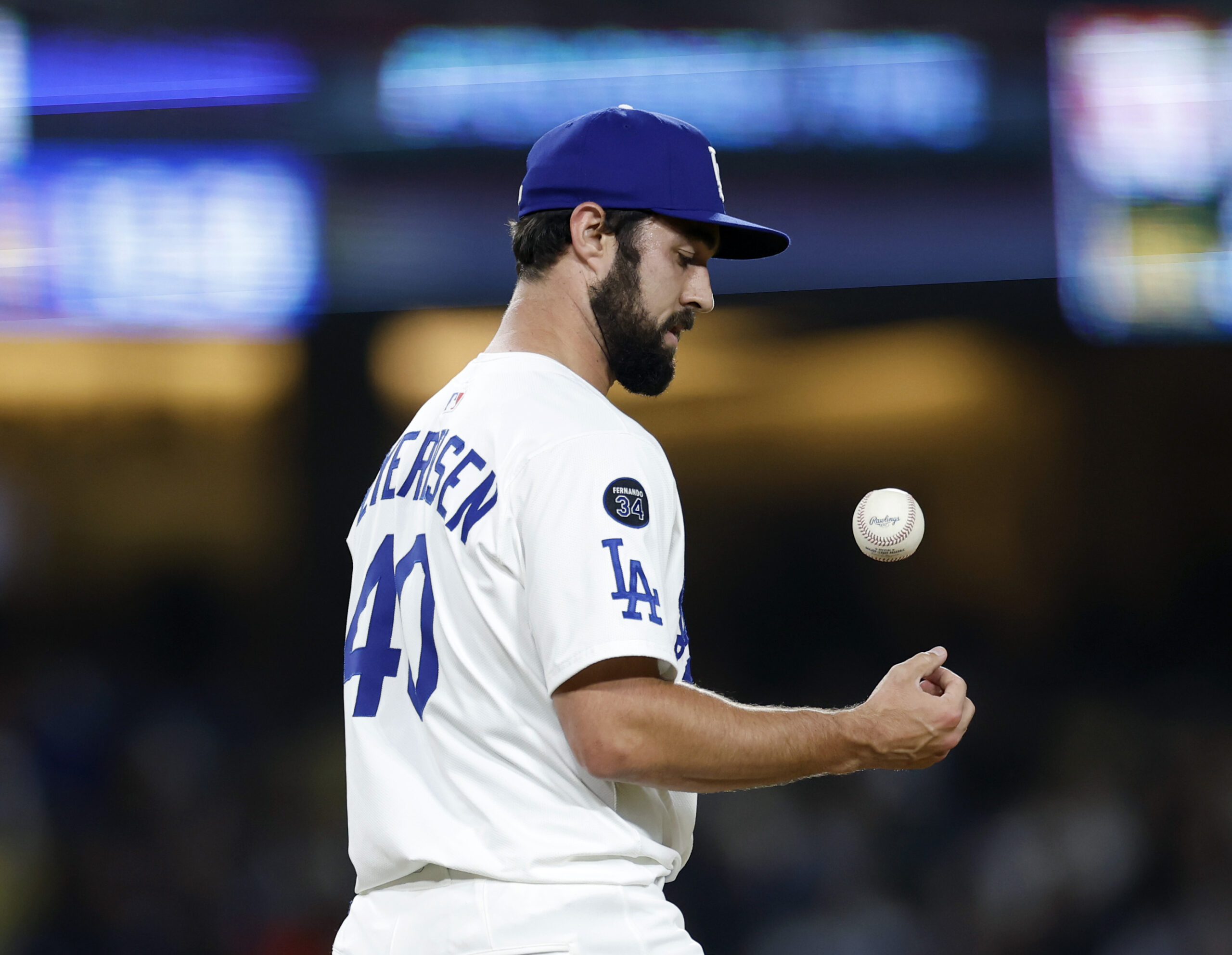 Dodgers relief pitcher JP Feyereisen tosses a baseball after an...
