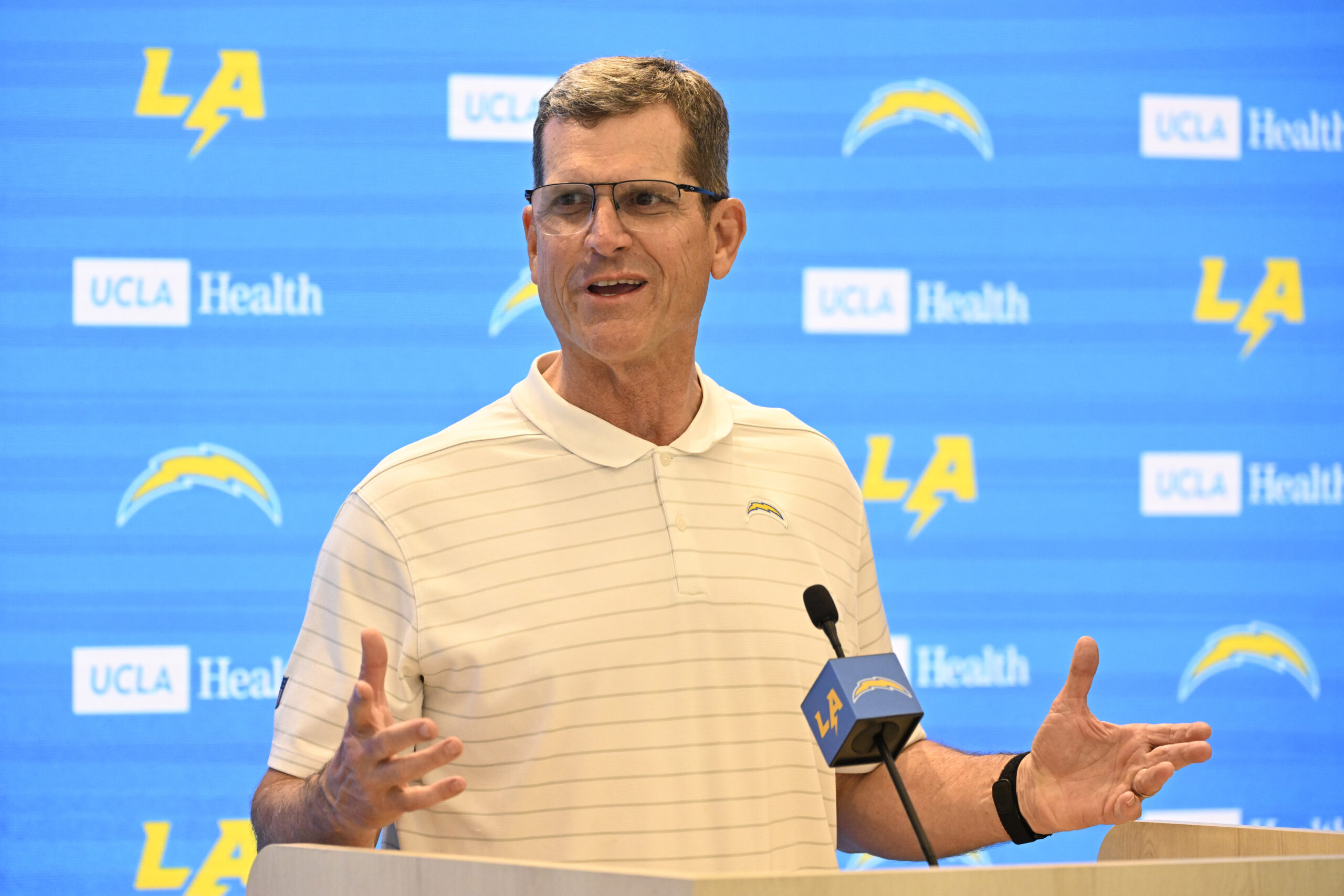 Chargers head coach Jim Harbaugh speaks to the media during...