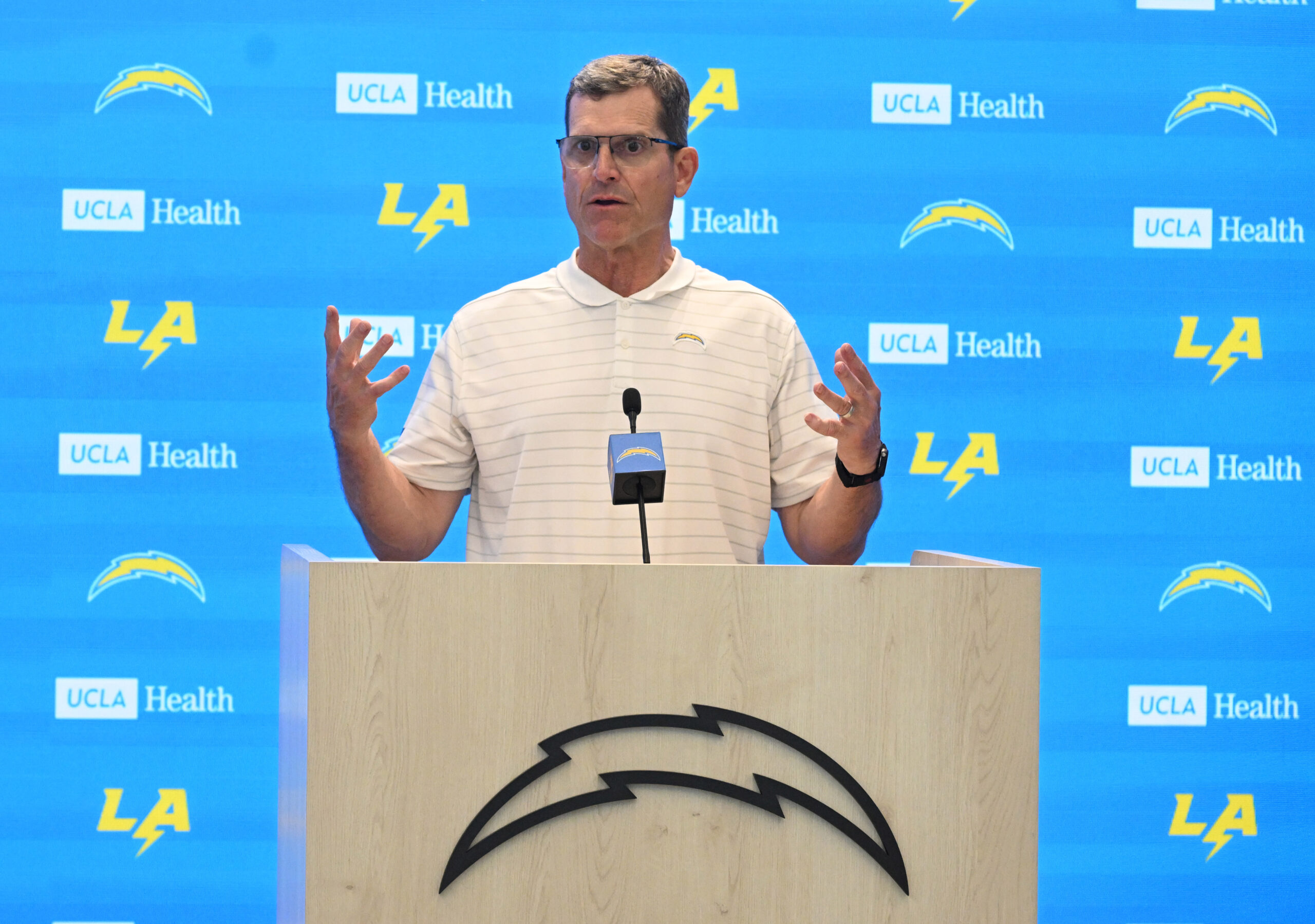 Chargers head coach Jim Harbaugh speaks to the media during...