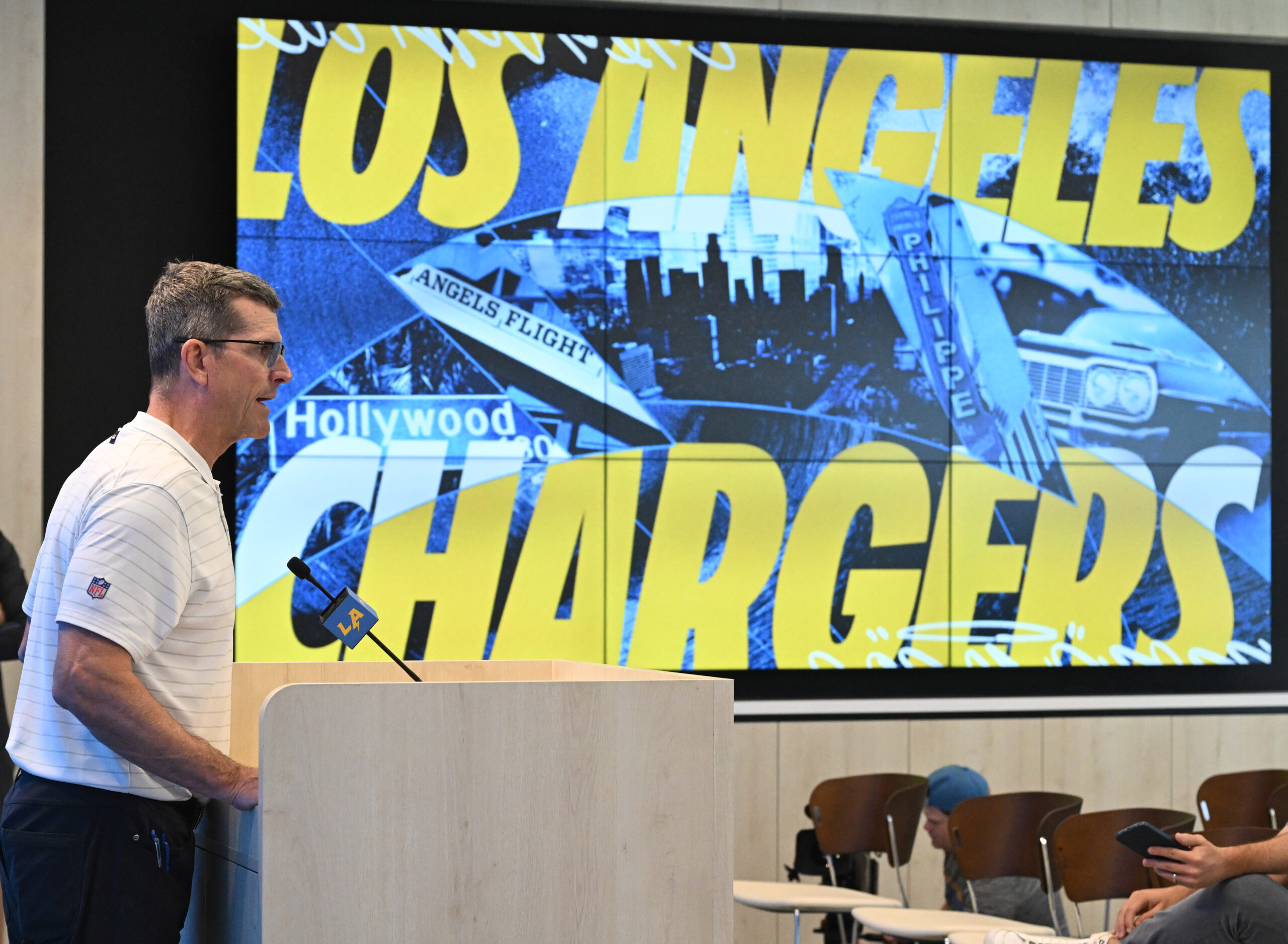 Chargers head coach Jim Harbaugh speaks to the media during...