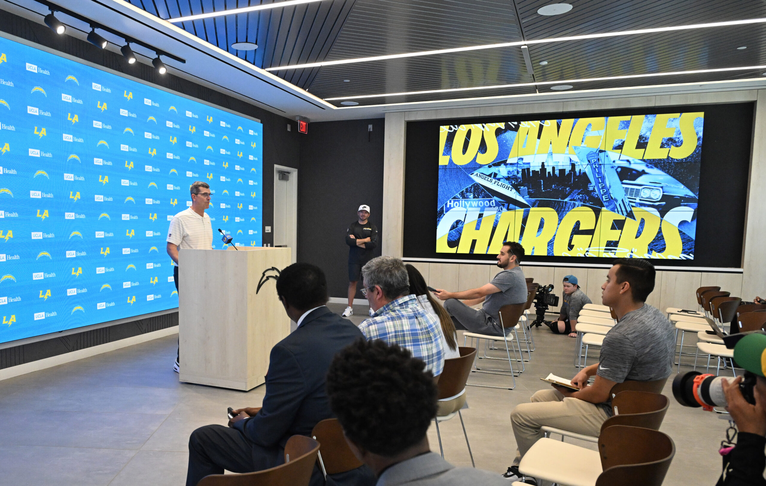 Chargers head coach Jim Harbaugh speaks to the media during...
