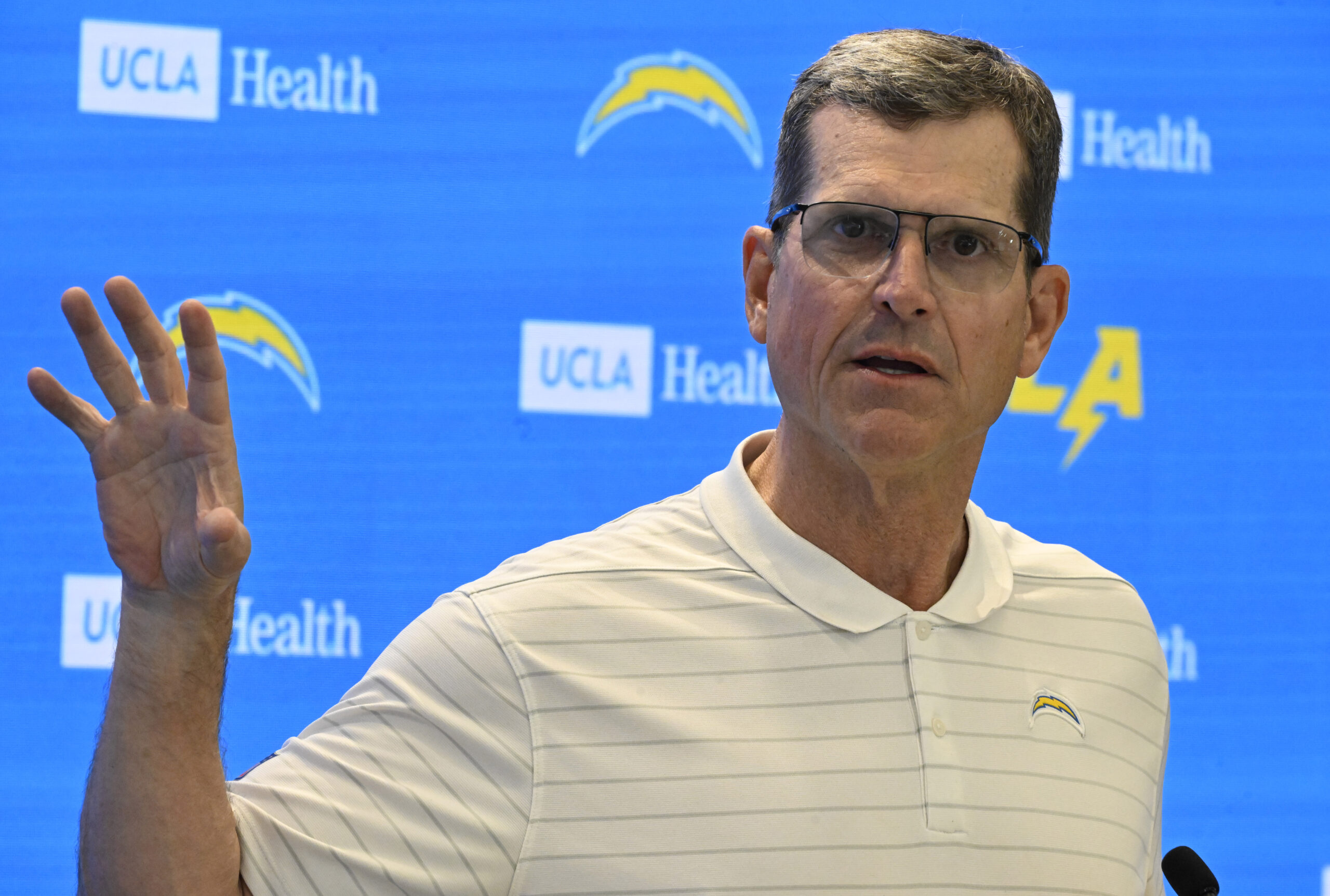 Chargers head coach Jim Harbaugh speaks to the media during...