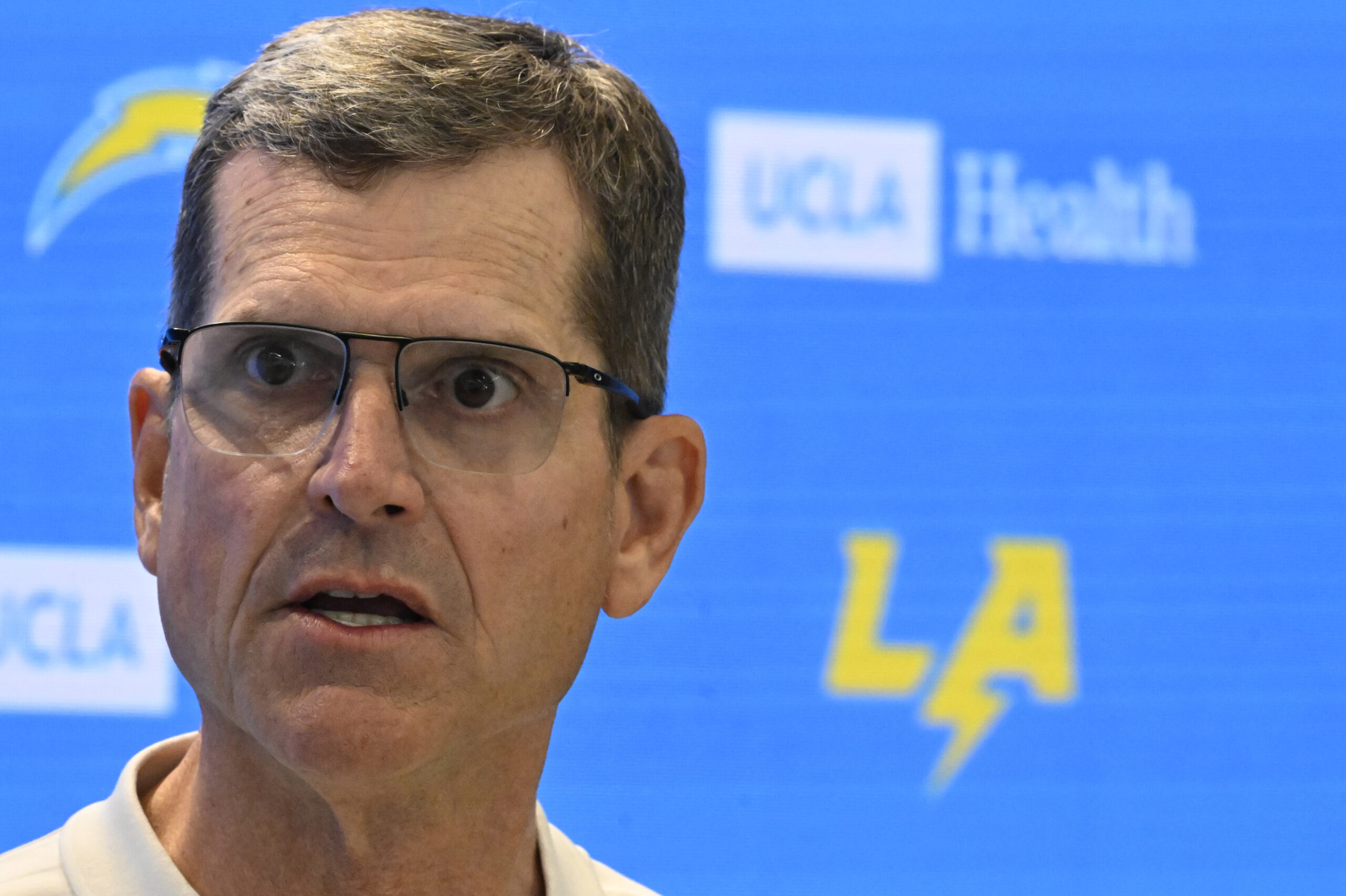 Chargers head coach Jim Harbaugh speaks to the media during...