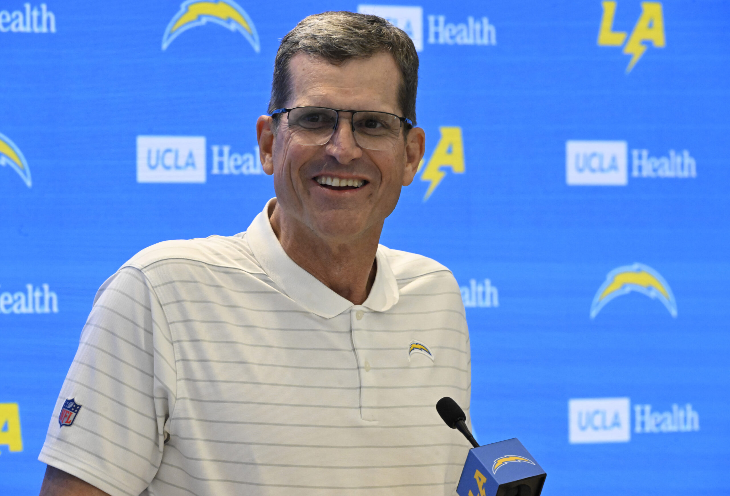 Chargers head coach Jim Harbaugh speaks to the media during...