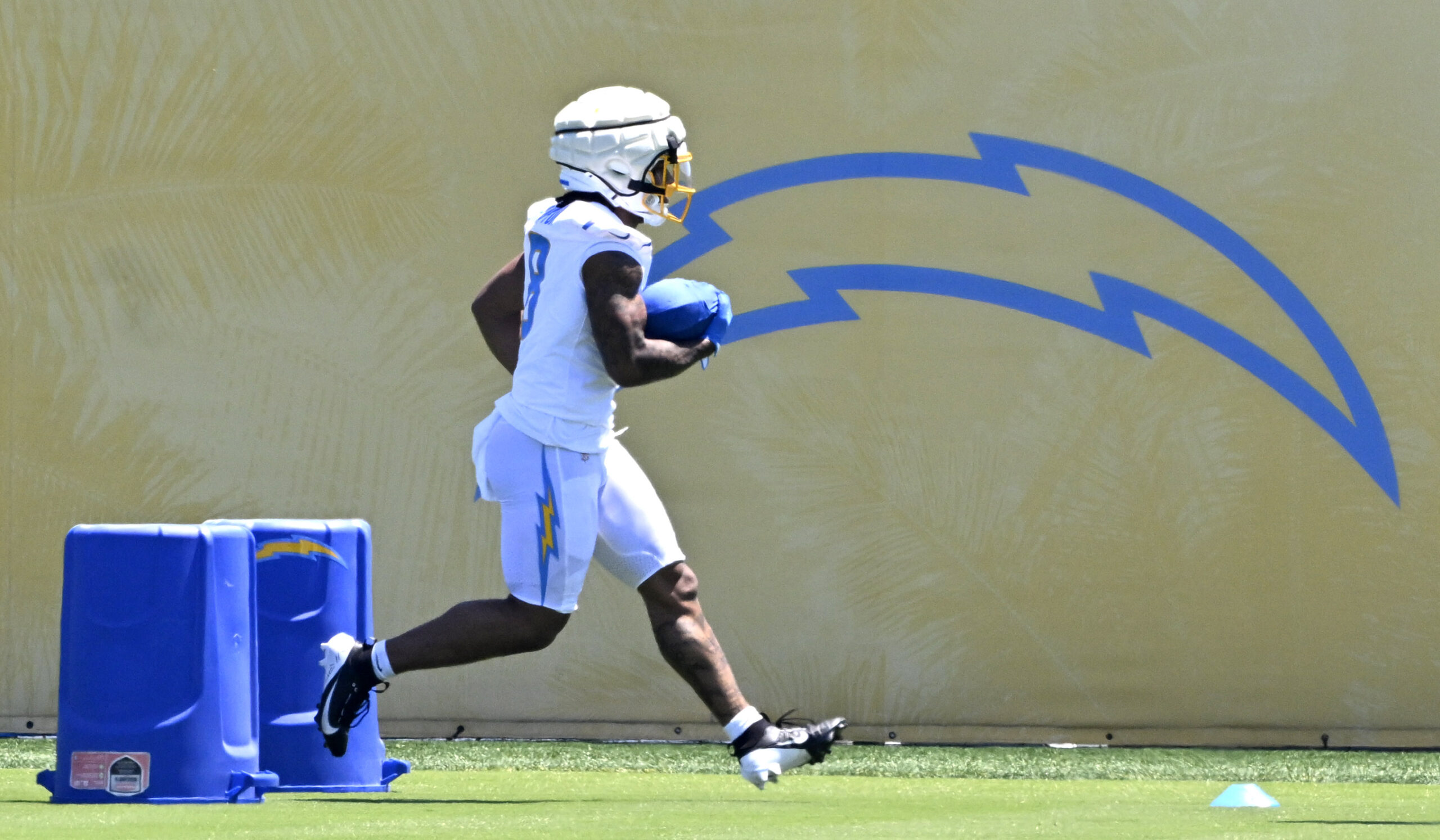 Chargers running back Omarion Hampton goes through drills during a...