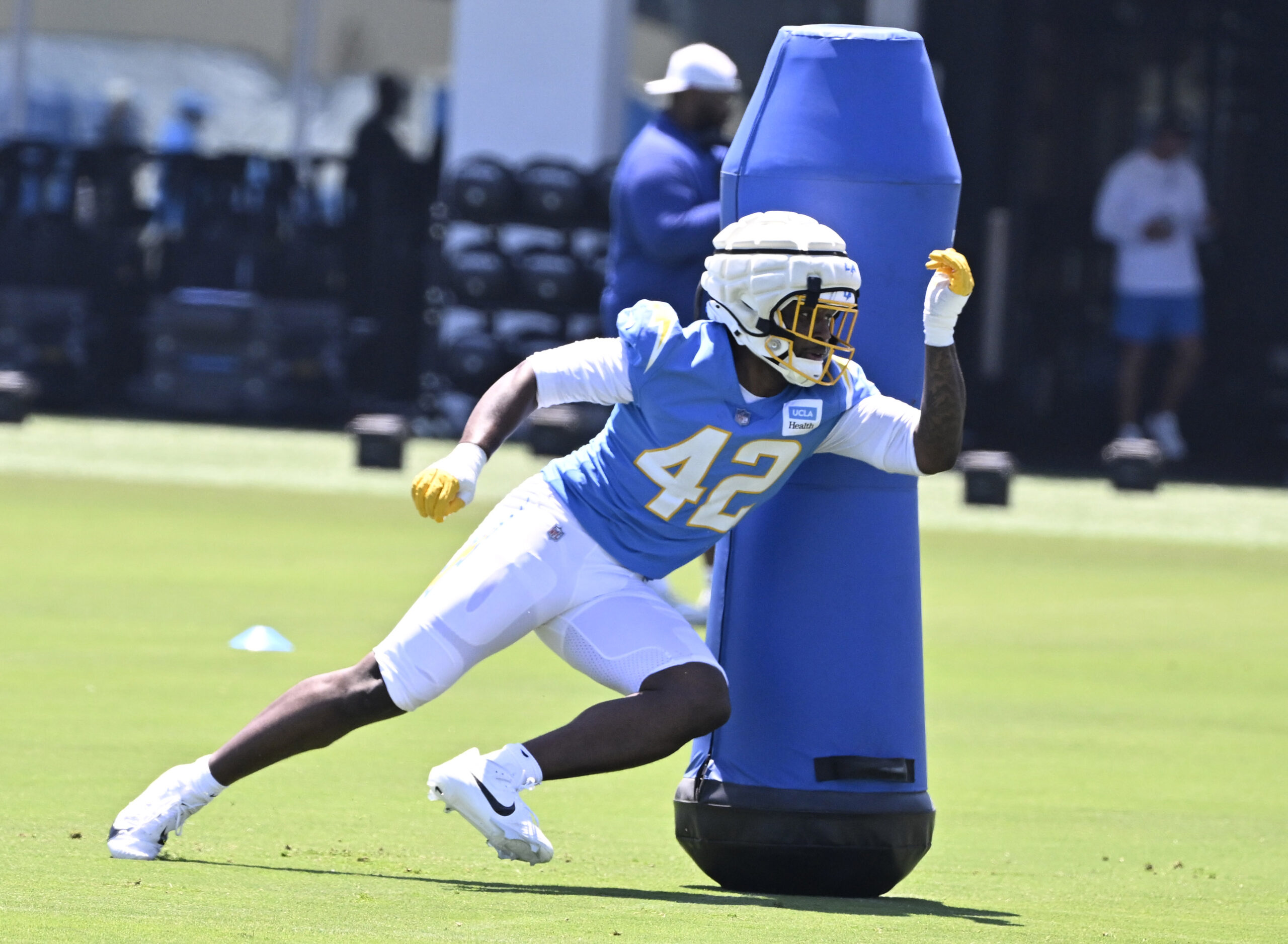 Chargers edge rusher Gilber Edmond goes through drills during a...