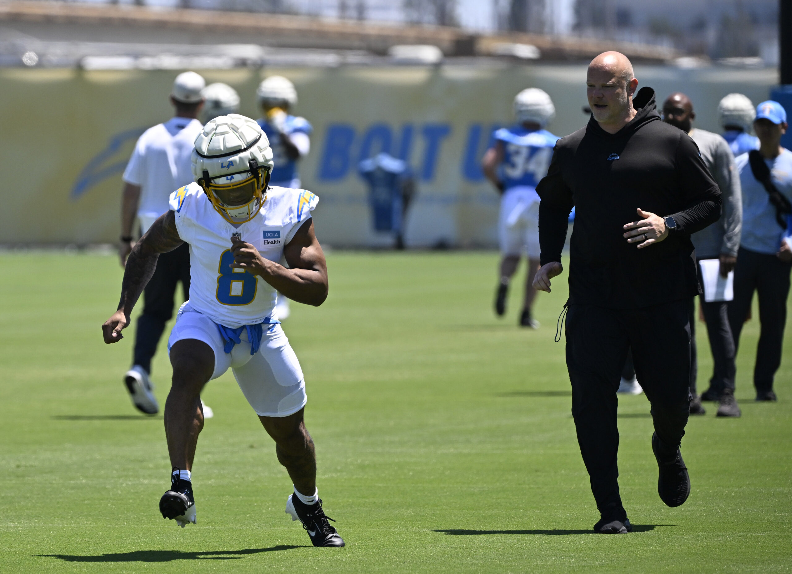 Chargers running back Omarion Hampton goes through drills during a...