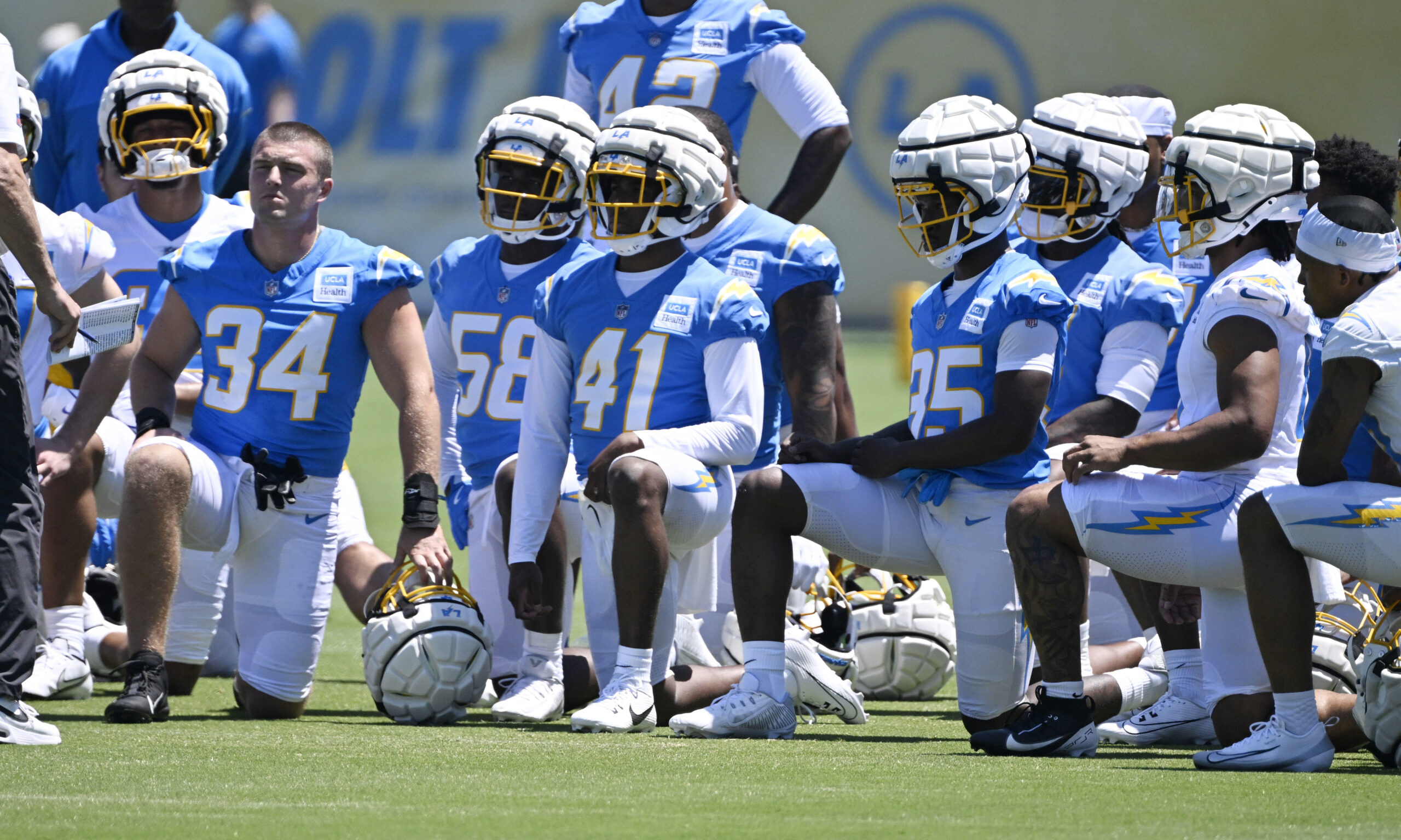 Chargers safety RJ Mickens (41) takes a knee with his...