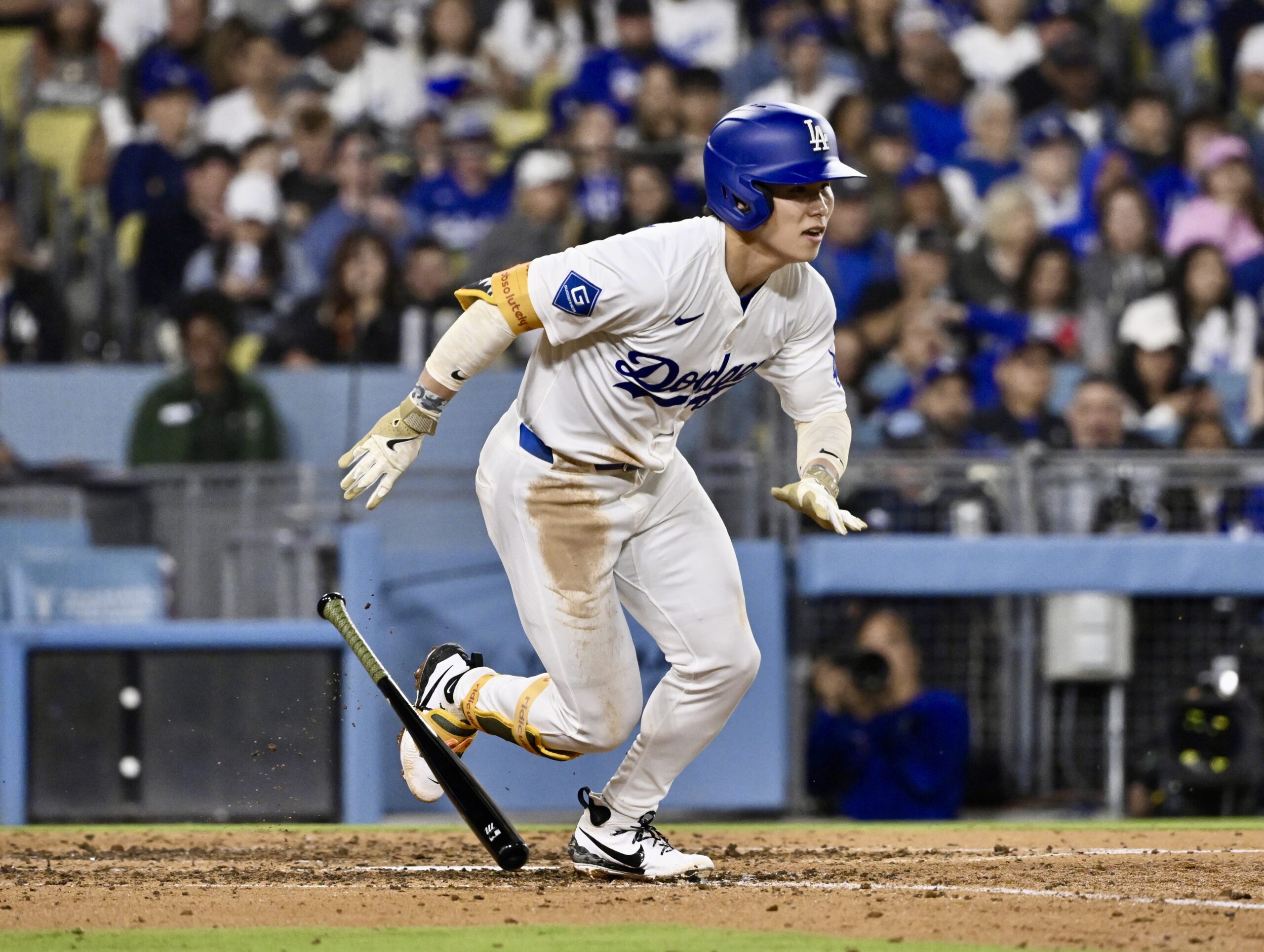 Hyeseong Kim #6 of the Los Angeles Dodgers singles against...