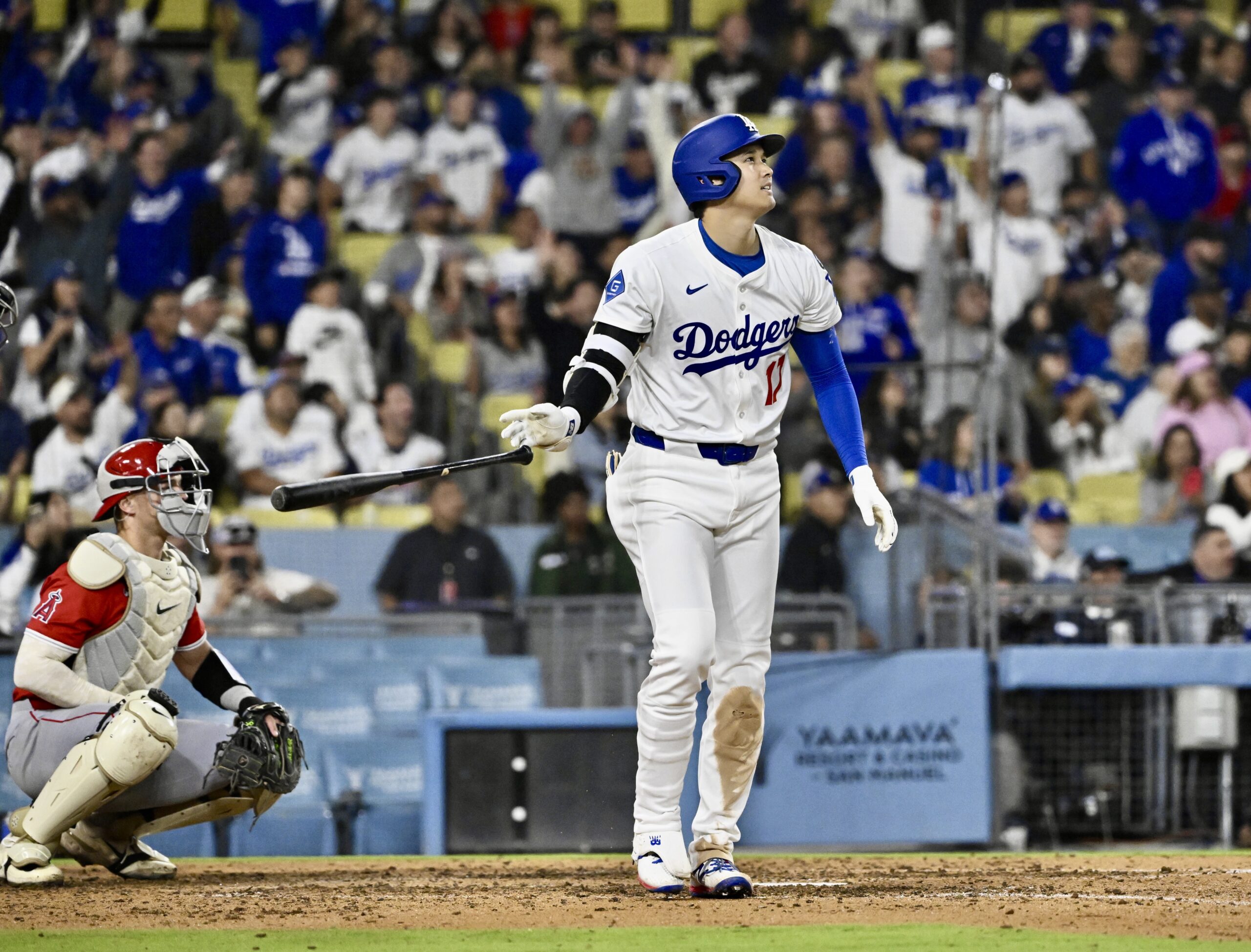 Shohei Ohtani #17 of the Los Angeles Dodgers watches his...