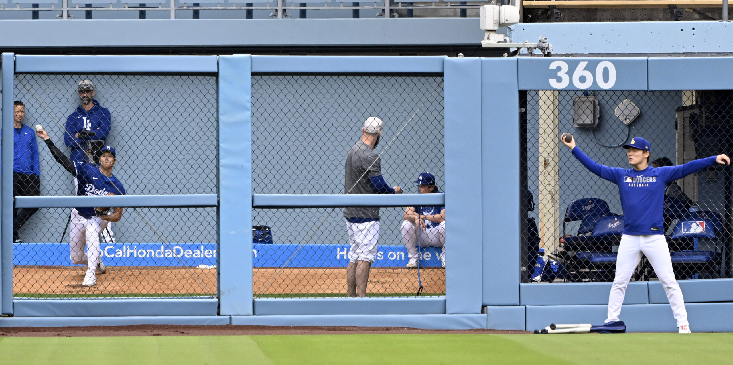 Shohei Ohtani #17 of the Dodgers throws in the bullpen...