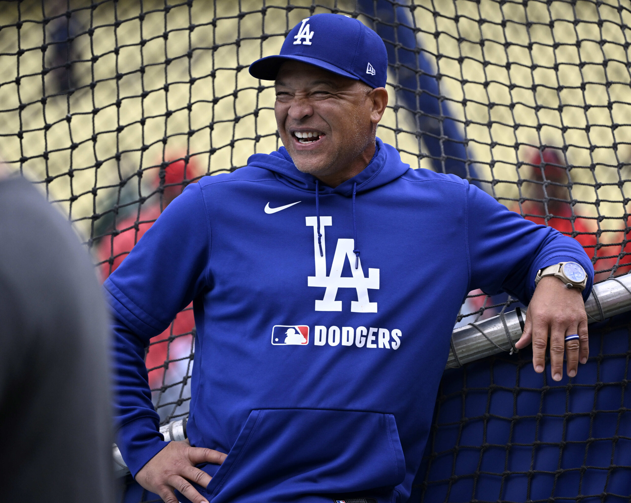 Manager Dave Roberts #30 of the Dodgers smiles at the...