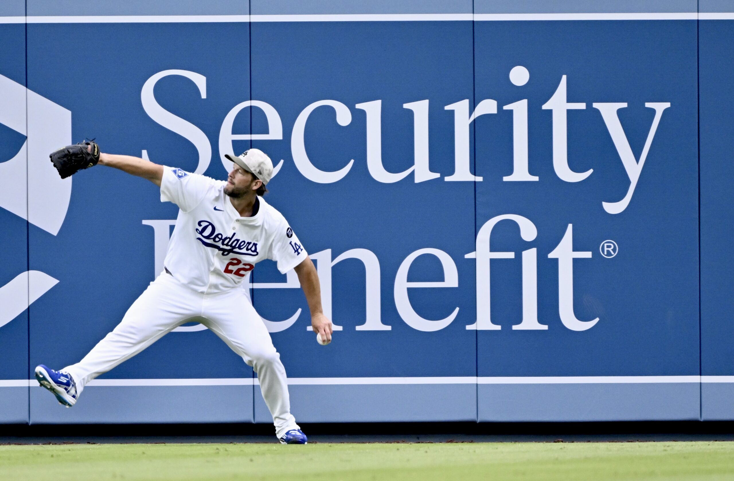 Starting pitcher Clayton Kershaw #22 of the Dodgers warms up...