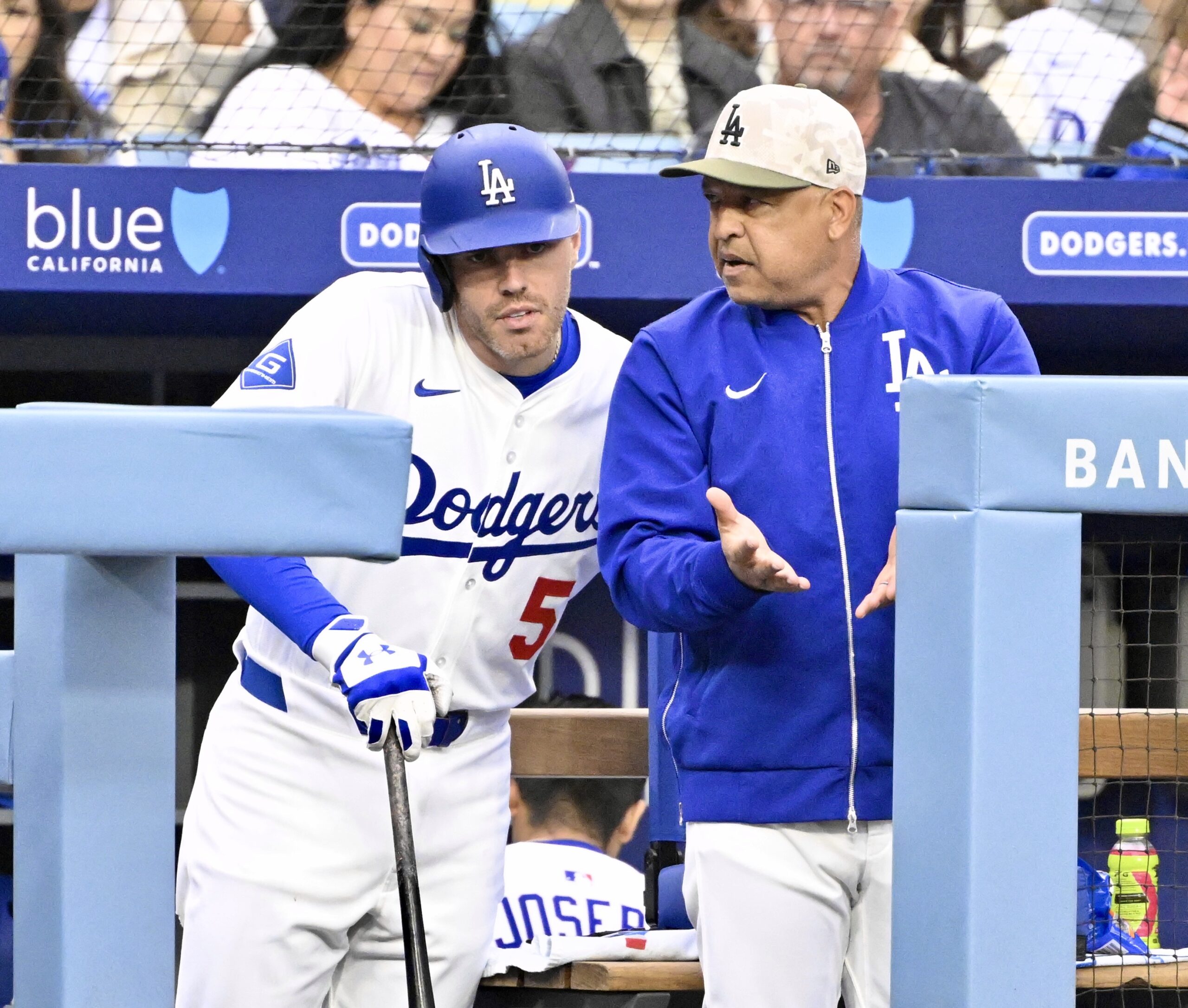 Manager Dave Roberts speaks with Freddie Freeman #5 of the...