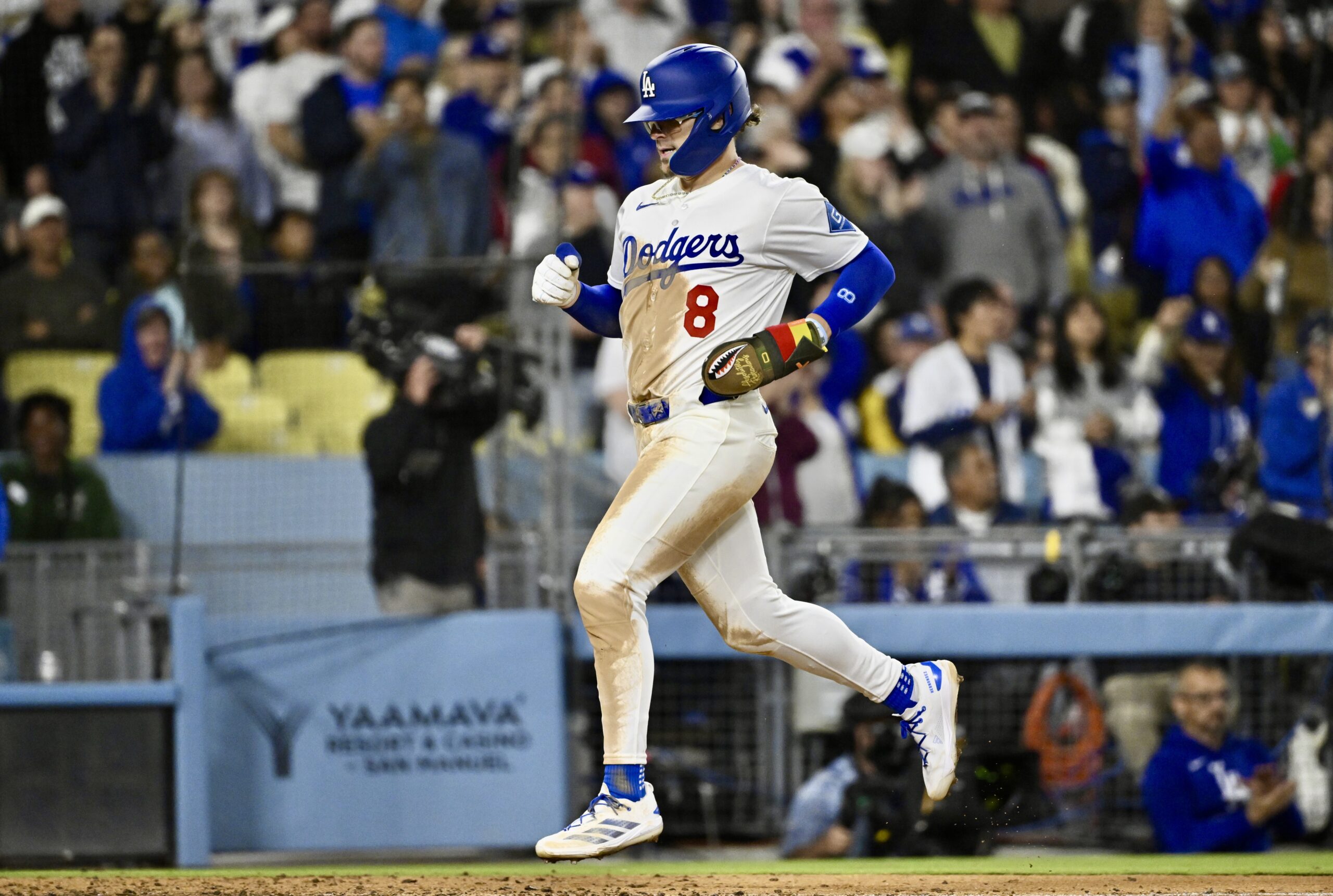 Kiki Hernandez #8 of the Dodgers scores on a single...