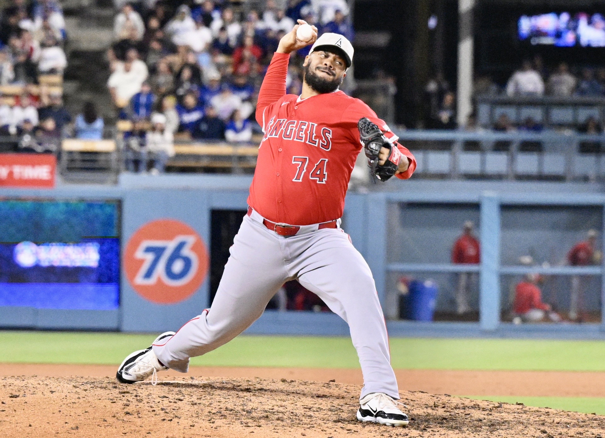 Relief pitcher Kenley Jansen #74 of the Angels throws to...
