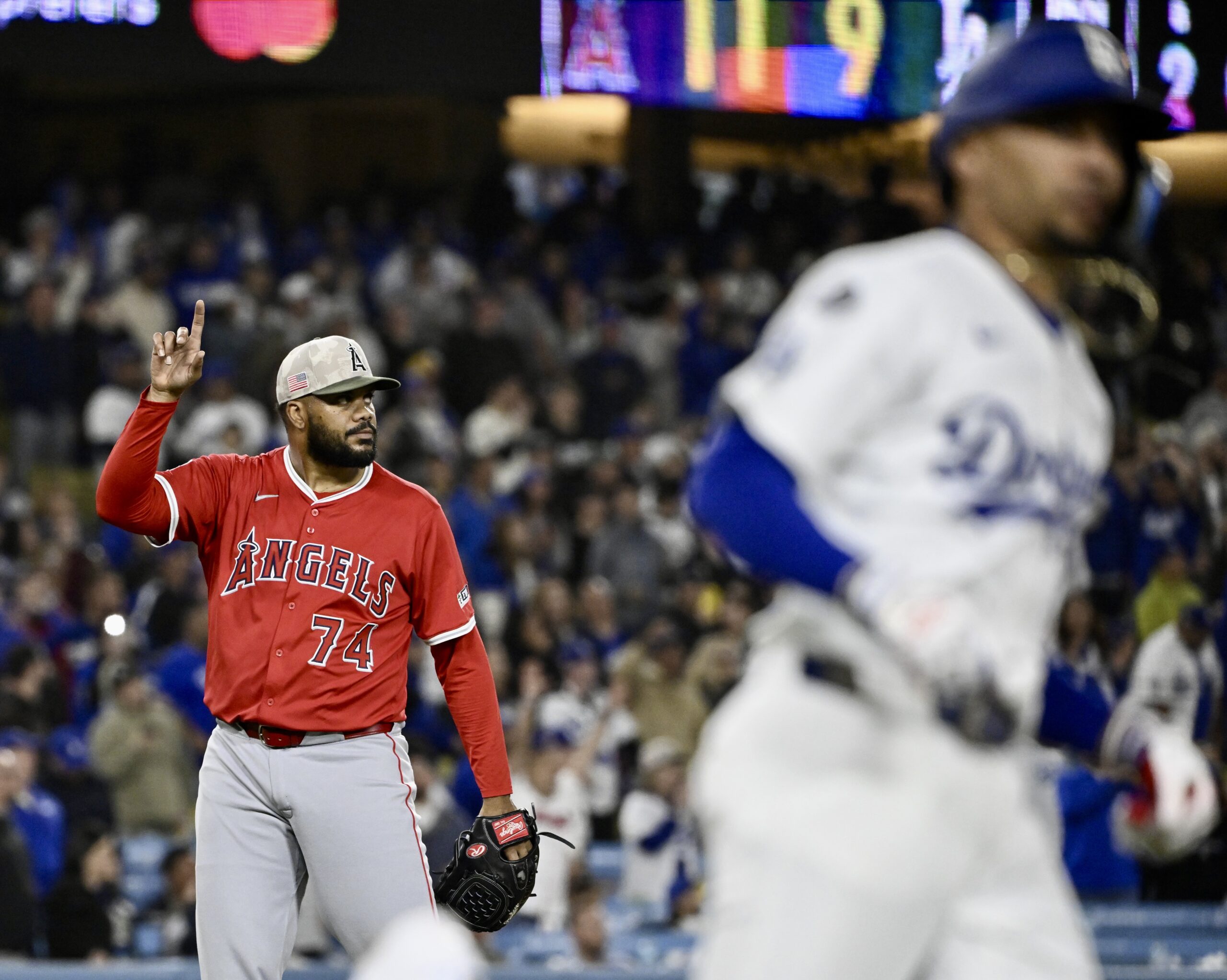 Relief pitcher Kenley Jansen #74 of the Angels points to...