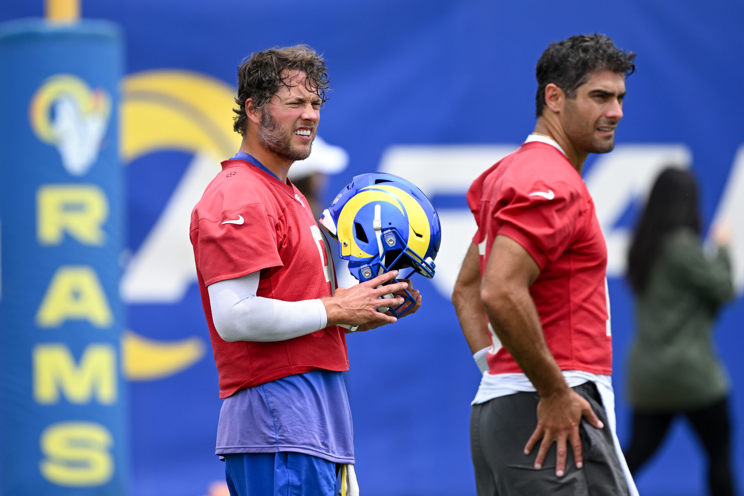 Rams quarterbacks Matthew Stafford, left, and Jimmy Garoppolo look on...