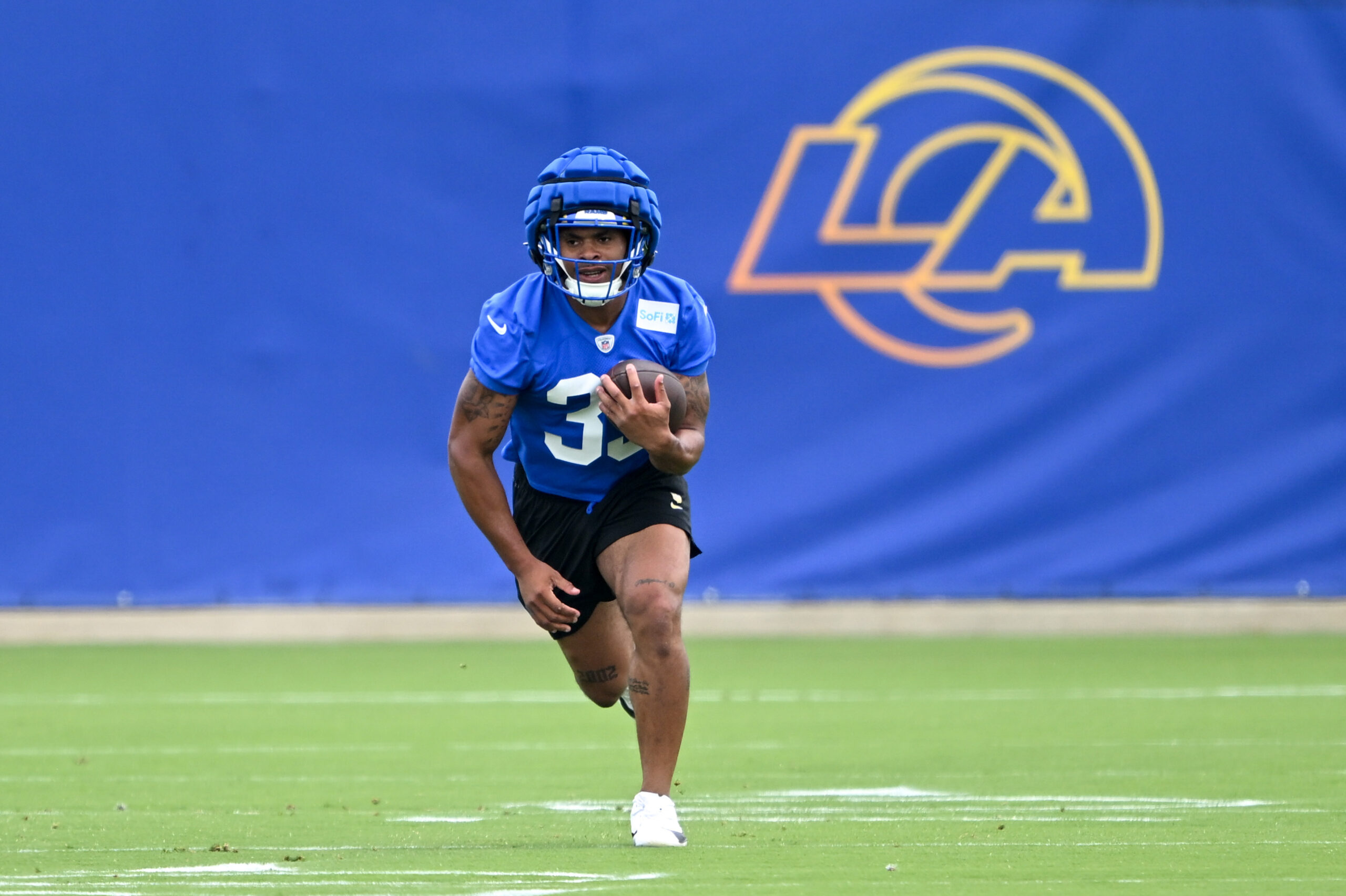 Rams running back Jarquez Hunter runs with the ball during...