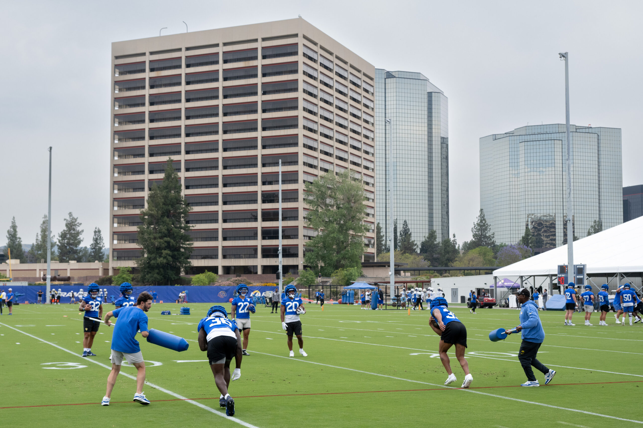 Rams players go through drills during an OTA workout on...