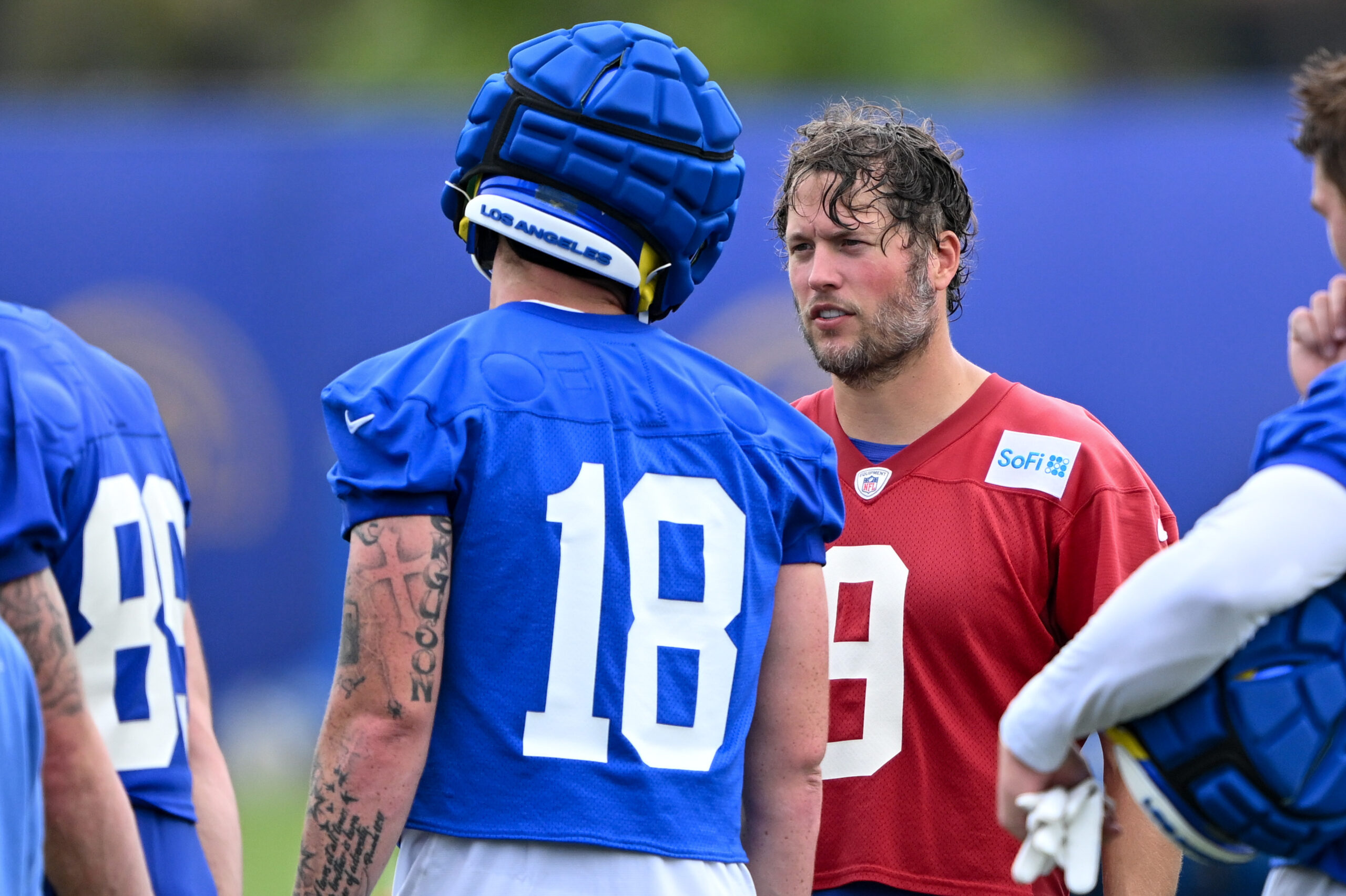 Rams quarterback Matthew Stafford, right, talks with tight end Terrance...