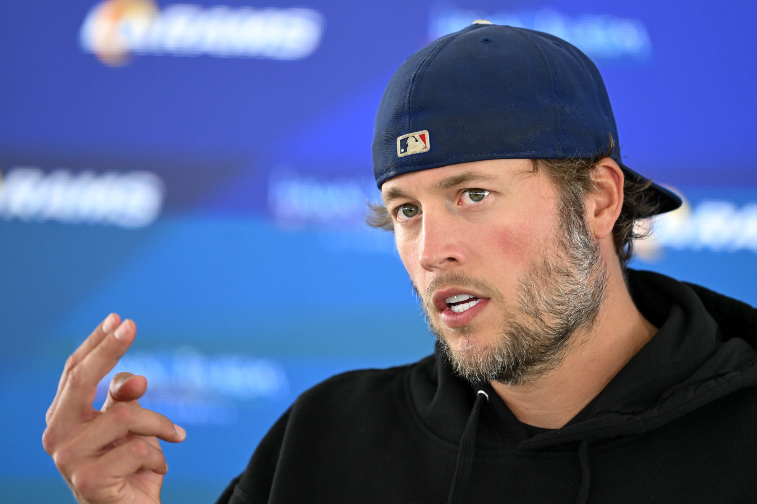 Rams quarterback Matthew Stafford talks to reporters during an OTA...